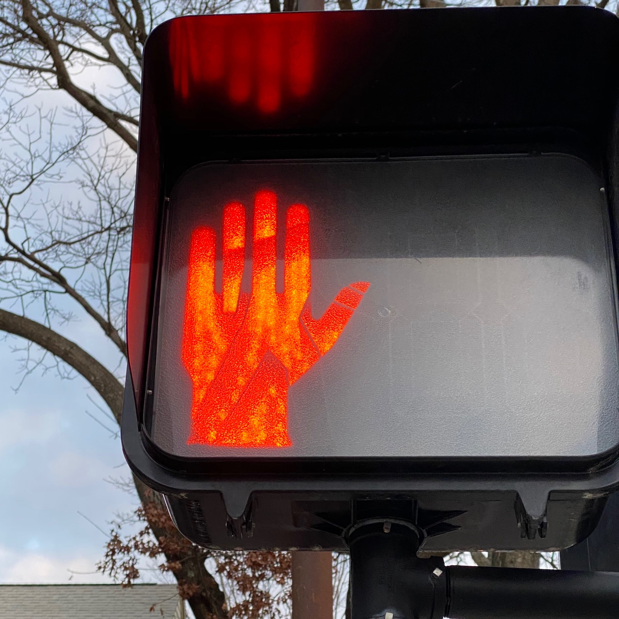 There’s a walking guy inside each stopping hand.