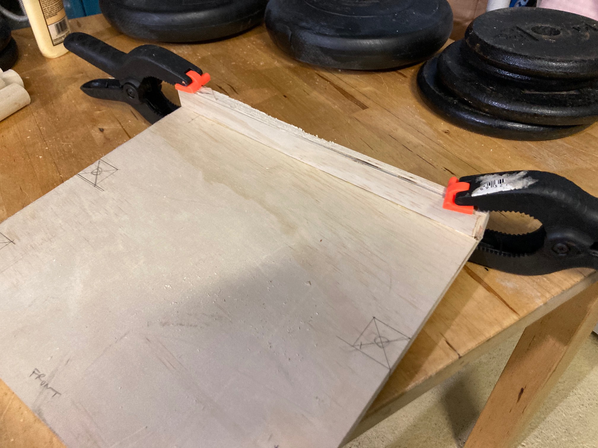 Gluing on the lip of the laptop shelf.