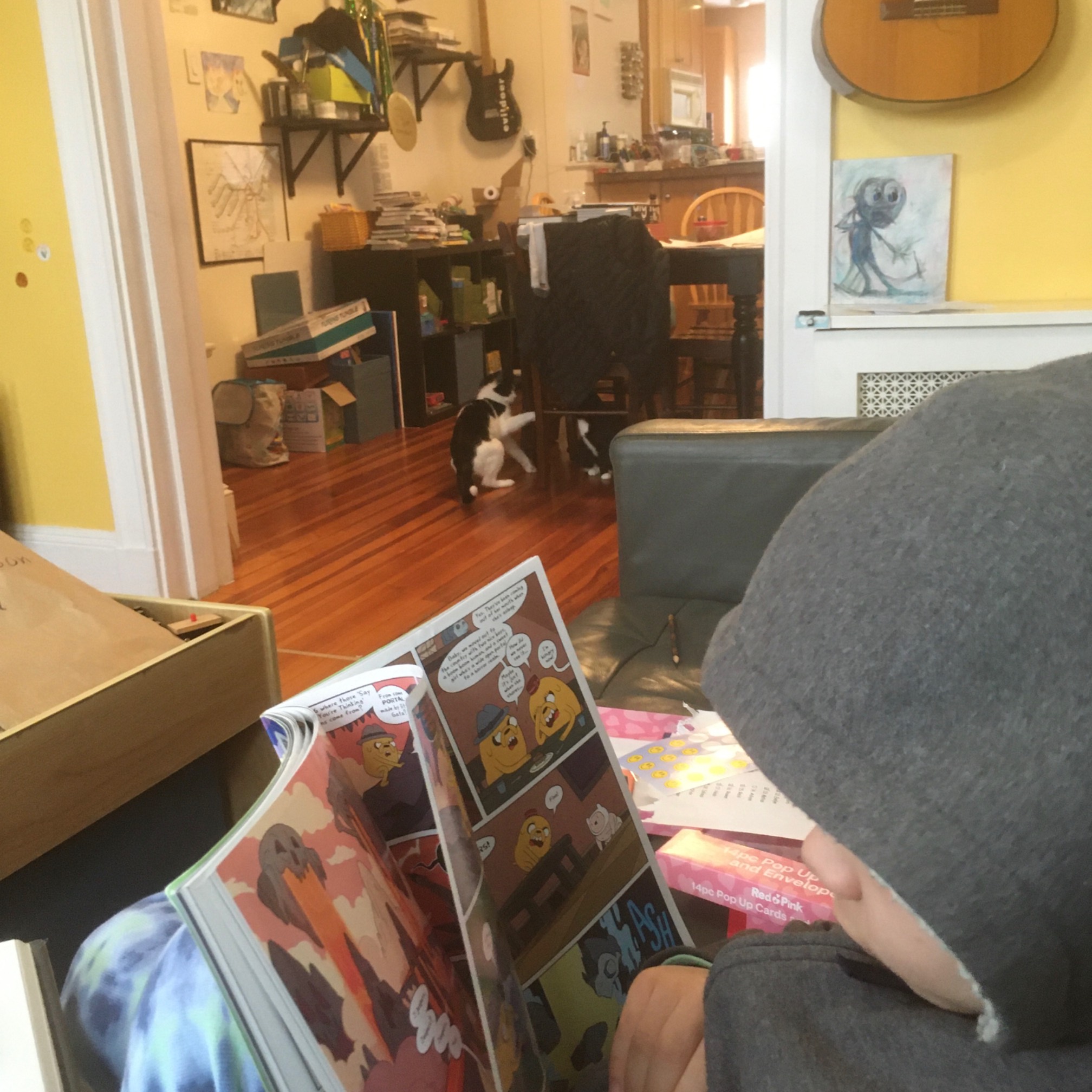 Cats are battlin’, we’re reading, I have coffee.