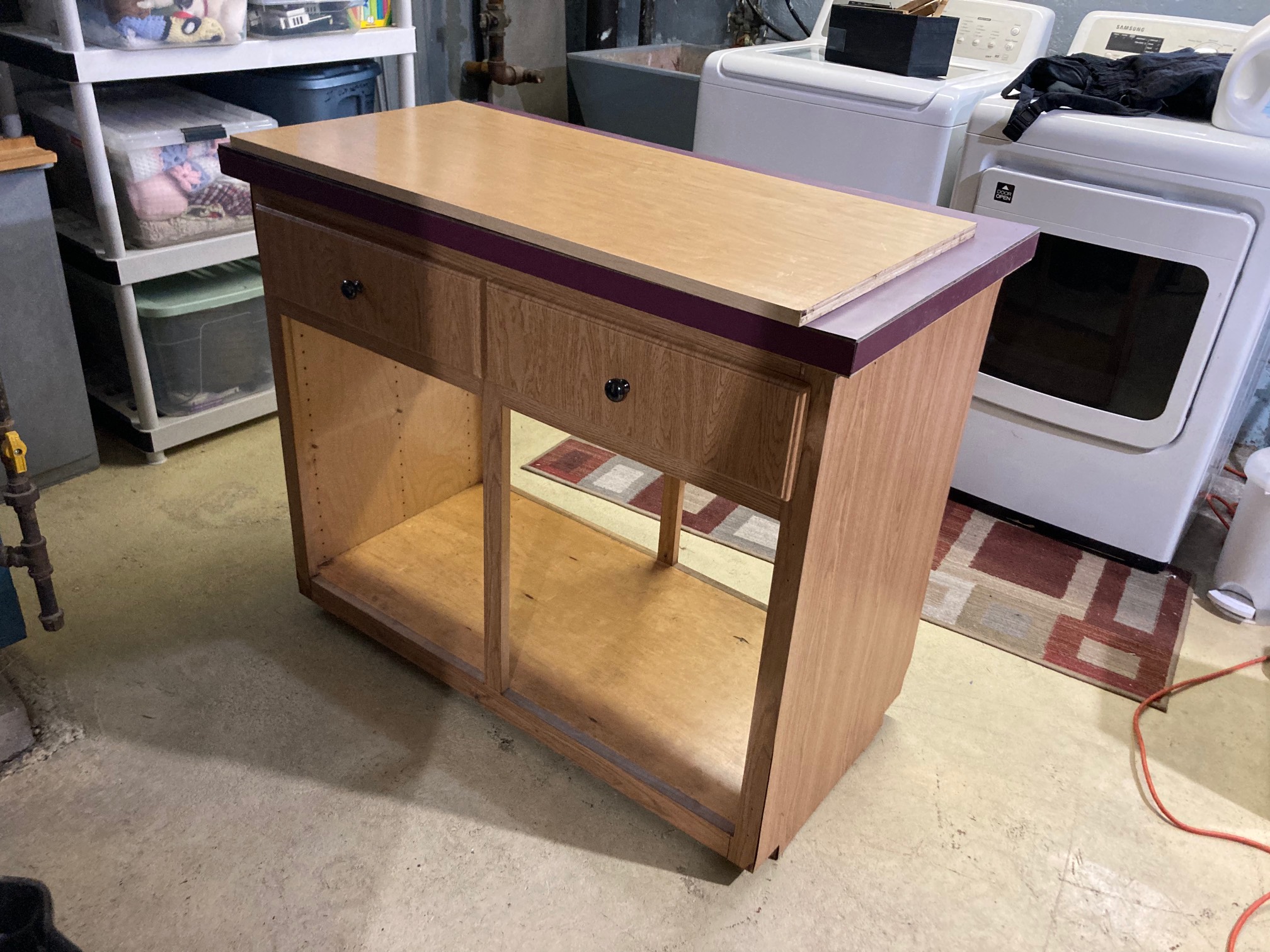 When we moved in, there was this kitchen island that both looked bad and made the kitchen into a ser