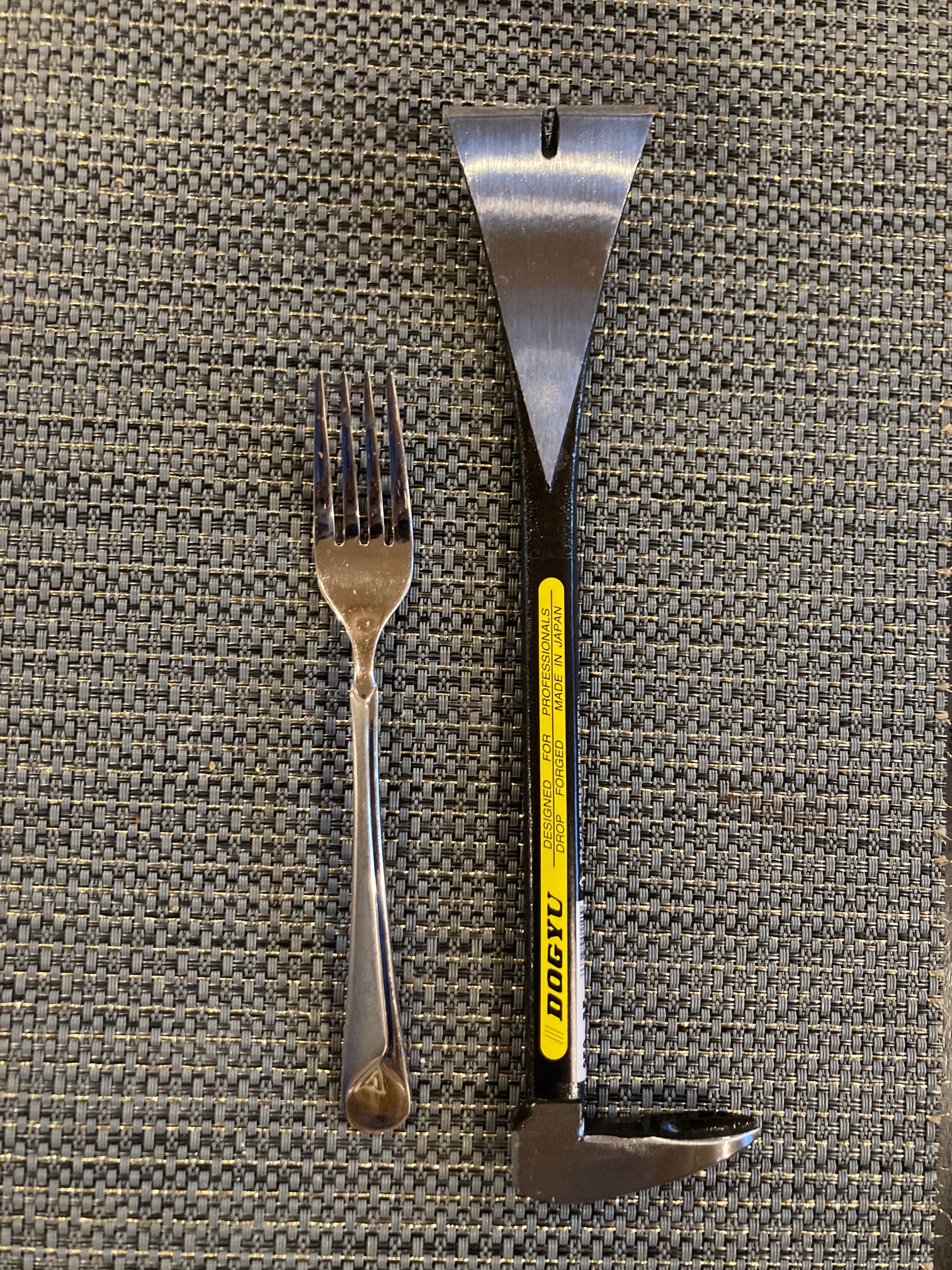 Fork and pry bar on placemat