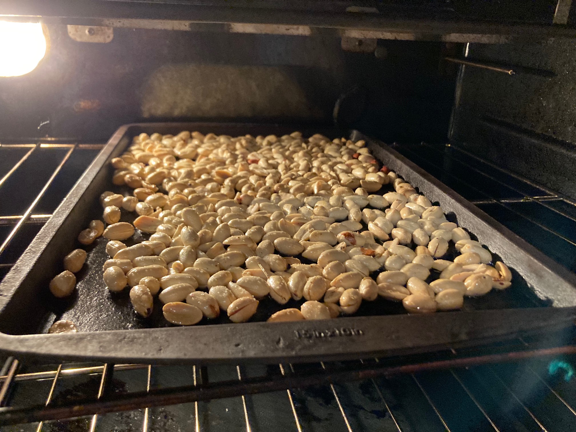 Peanuts on a tray in an oven