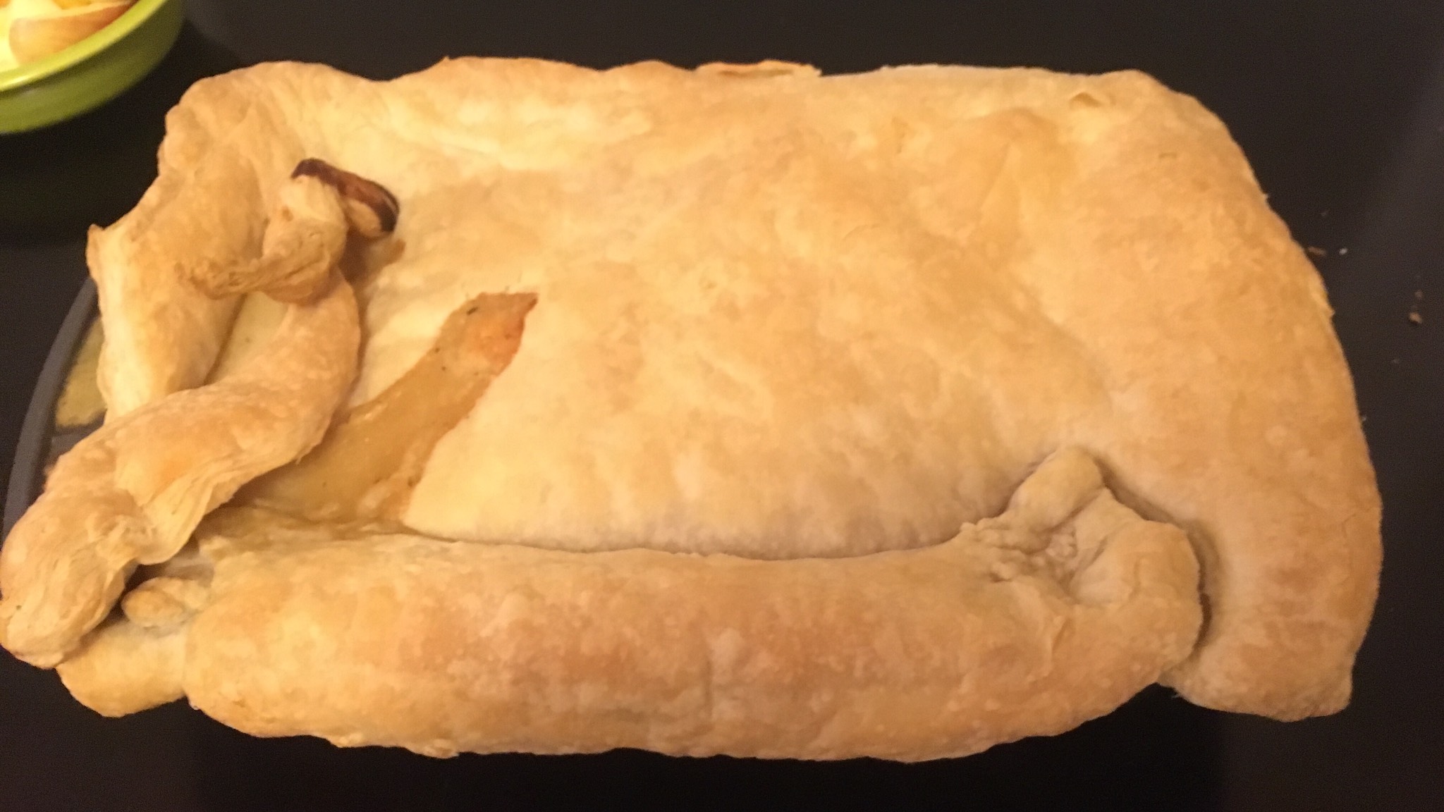 My cut-and-paste job on the puff pastry resulted in A) a filling leak and B) some Giger-esque lumps 