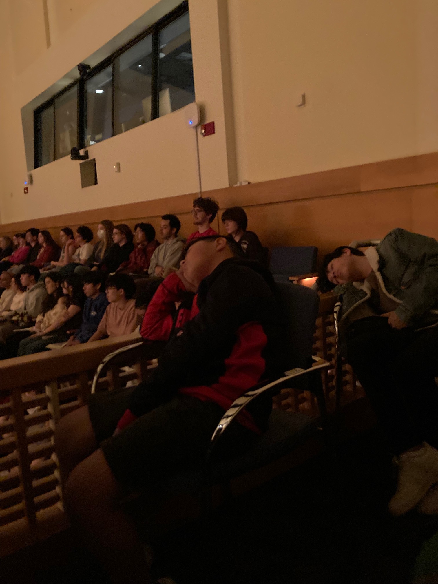 Audience with two members sleeping