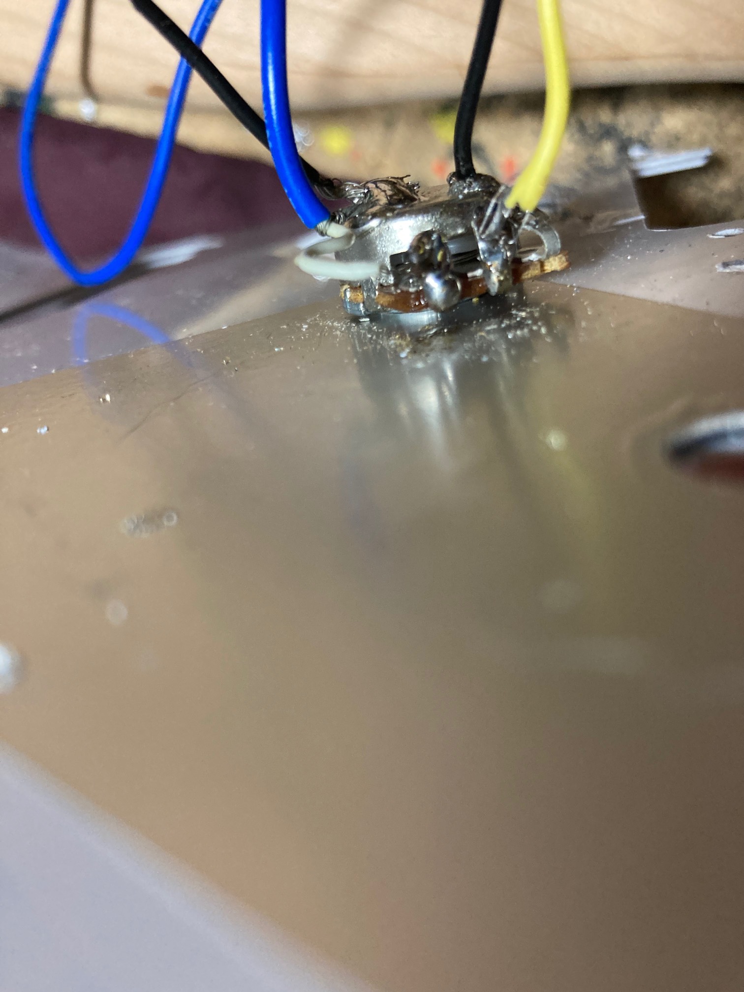 The final problem was that solder had dropped down from the blue wire (the pickup) connection to the