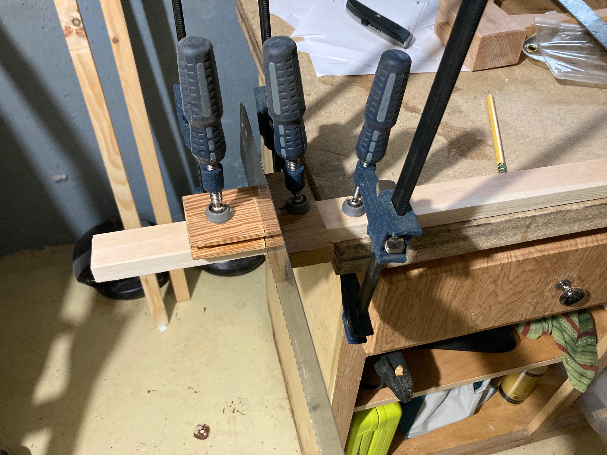 You can make a handsaw miter with two clamps and some junk. Clamps, man.