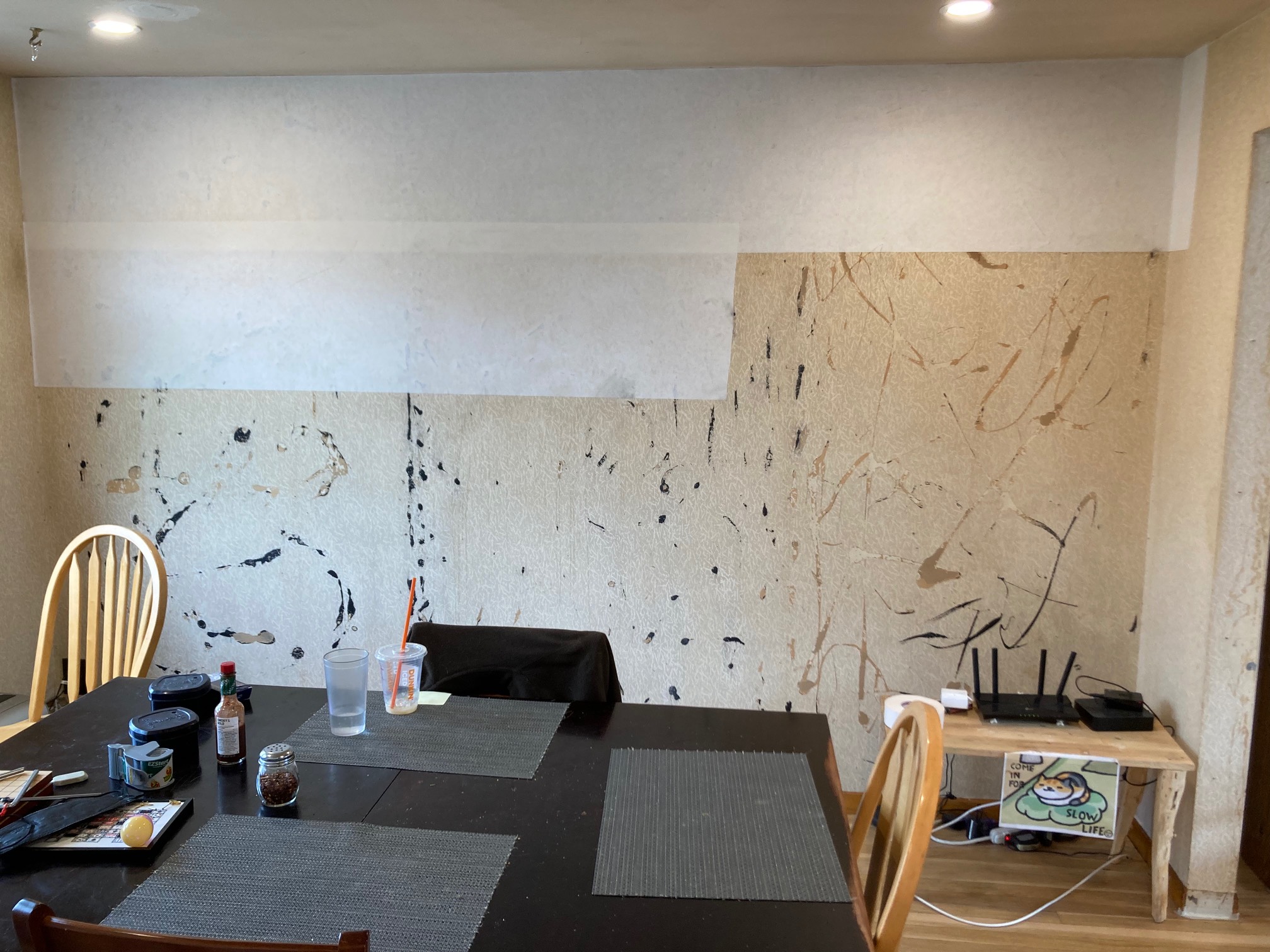 Wall with old glue half covered with liner