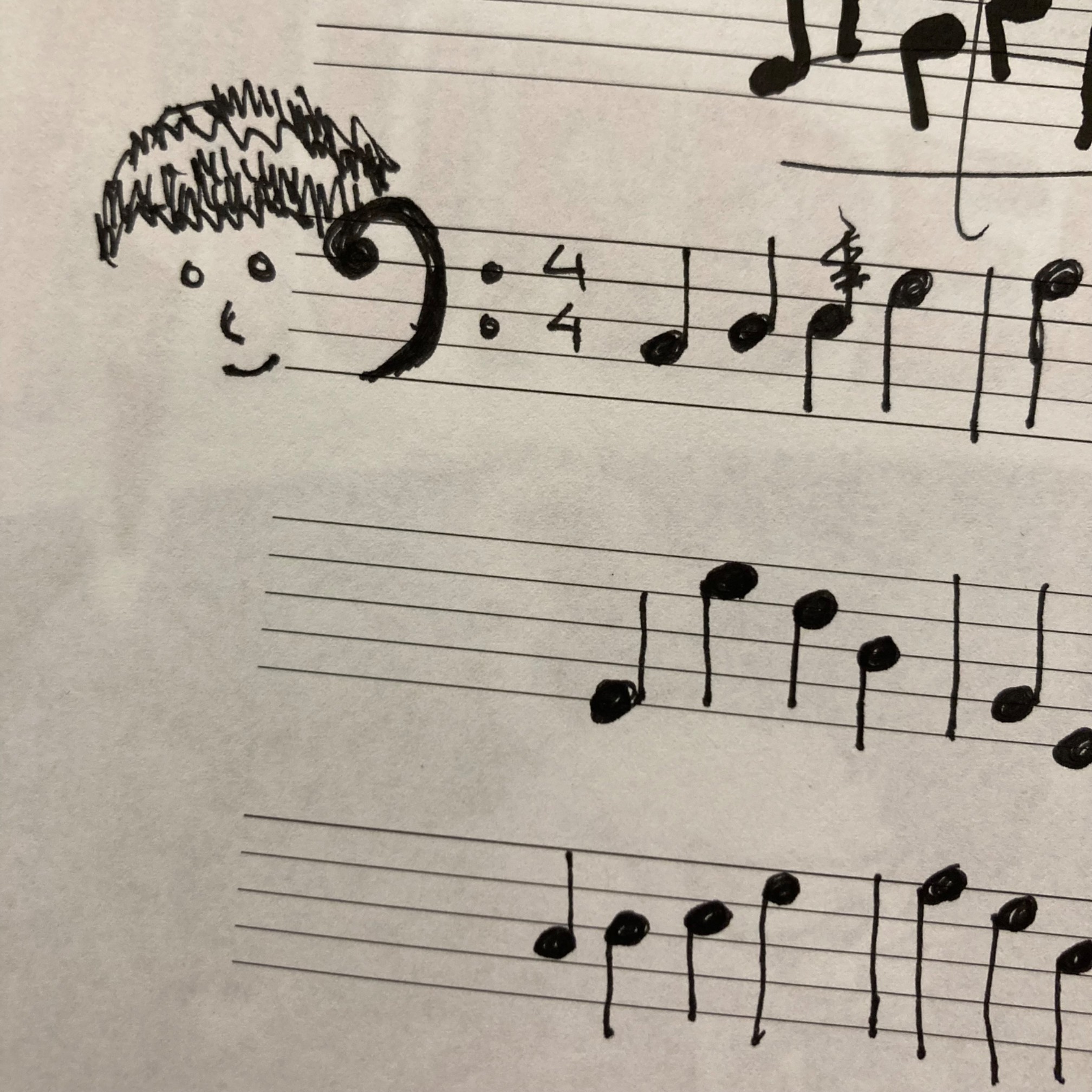 Sheet music with a face superimposed over a bass clef