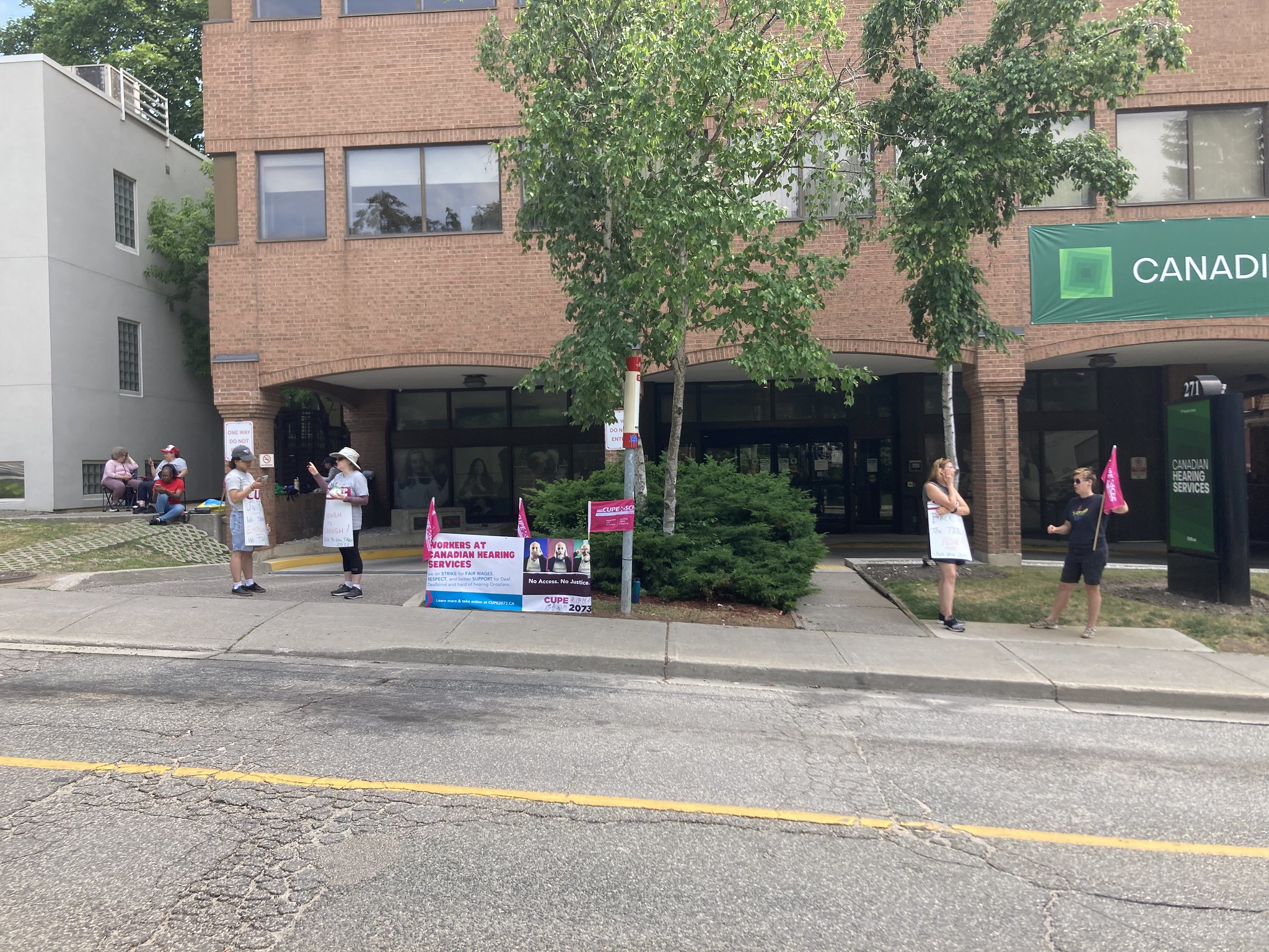 People striking in front of building