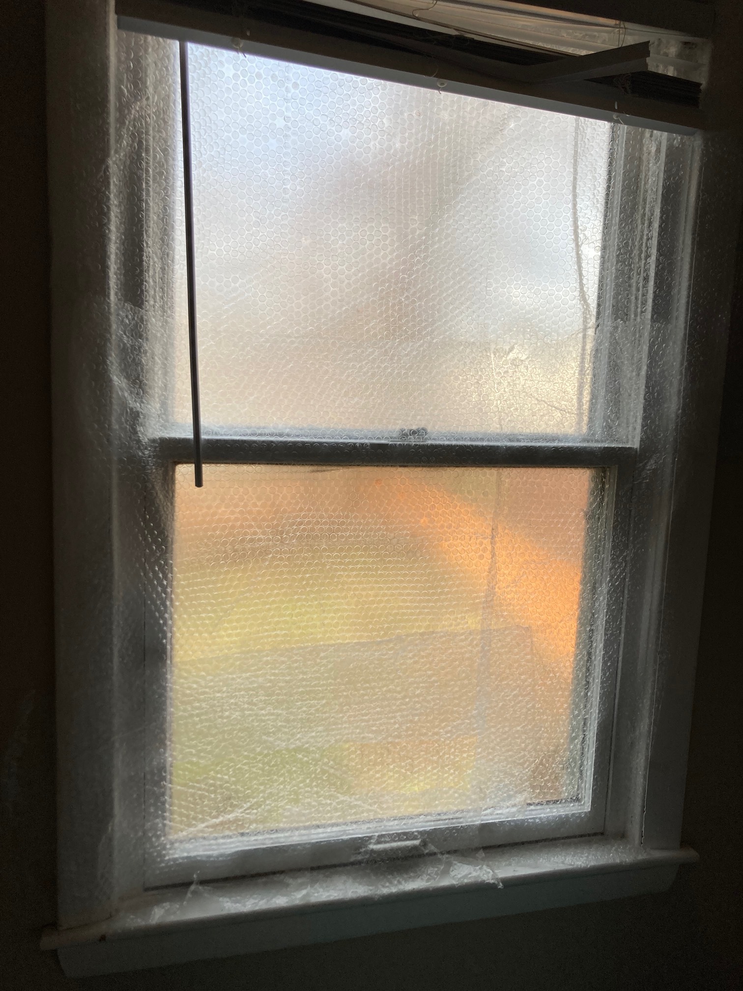 Doing a mid-range noise attenuation experiment. (I taped bubble wrap to the window to see if window 