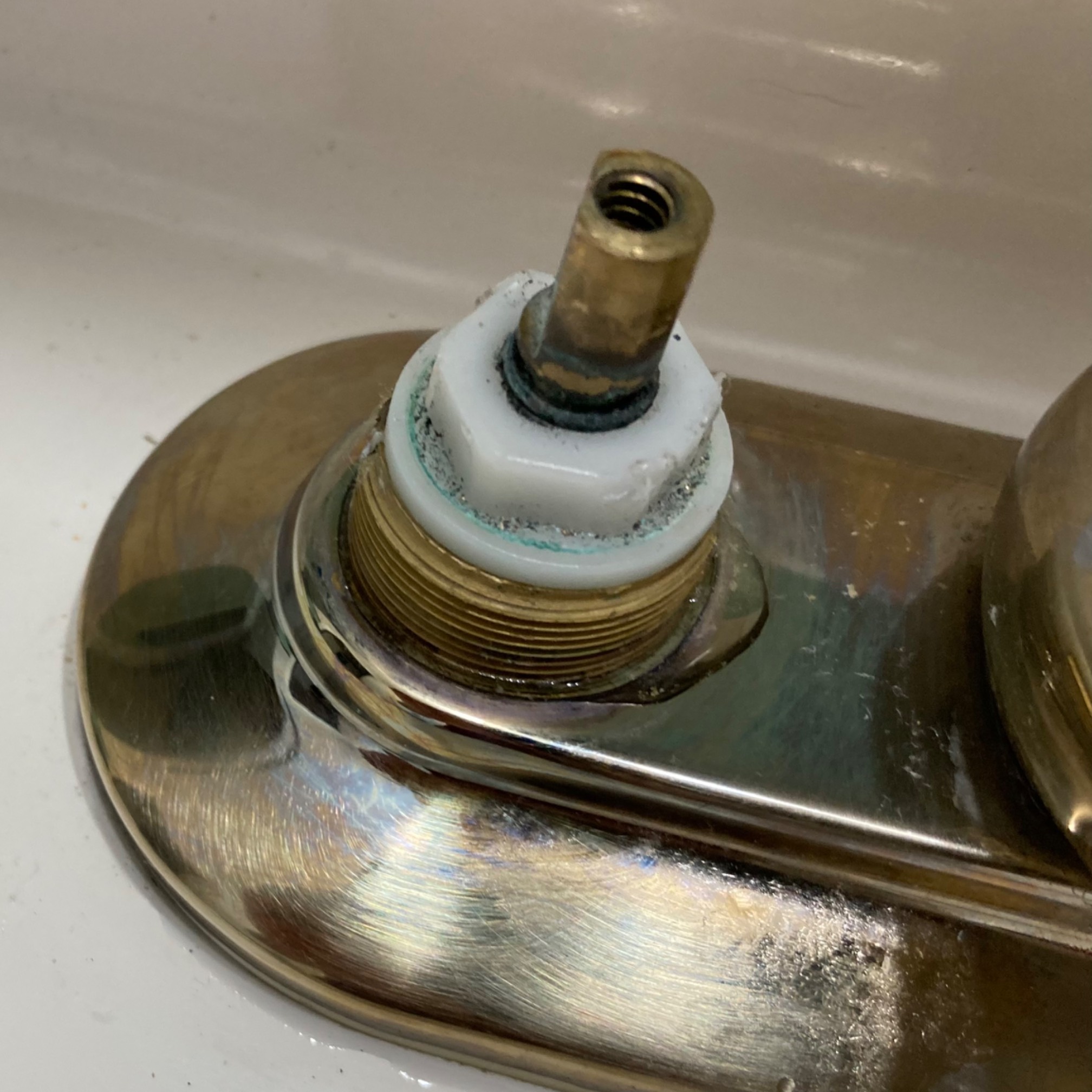 Just squishing down the plastic nut stops the leak from that part, then it leaks from the bottom.