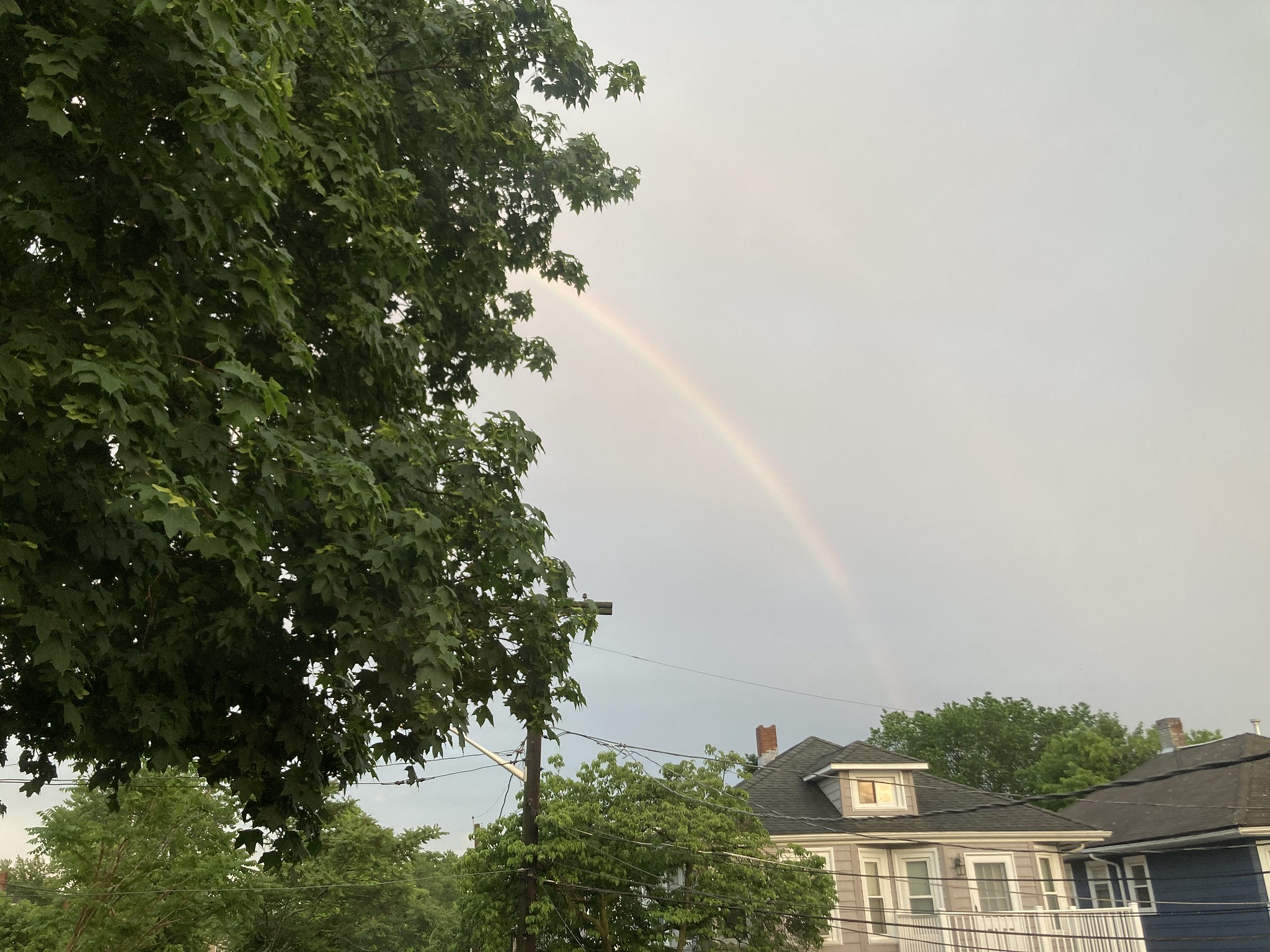 Rainbow over house
