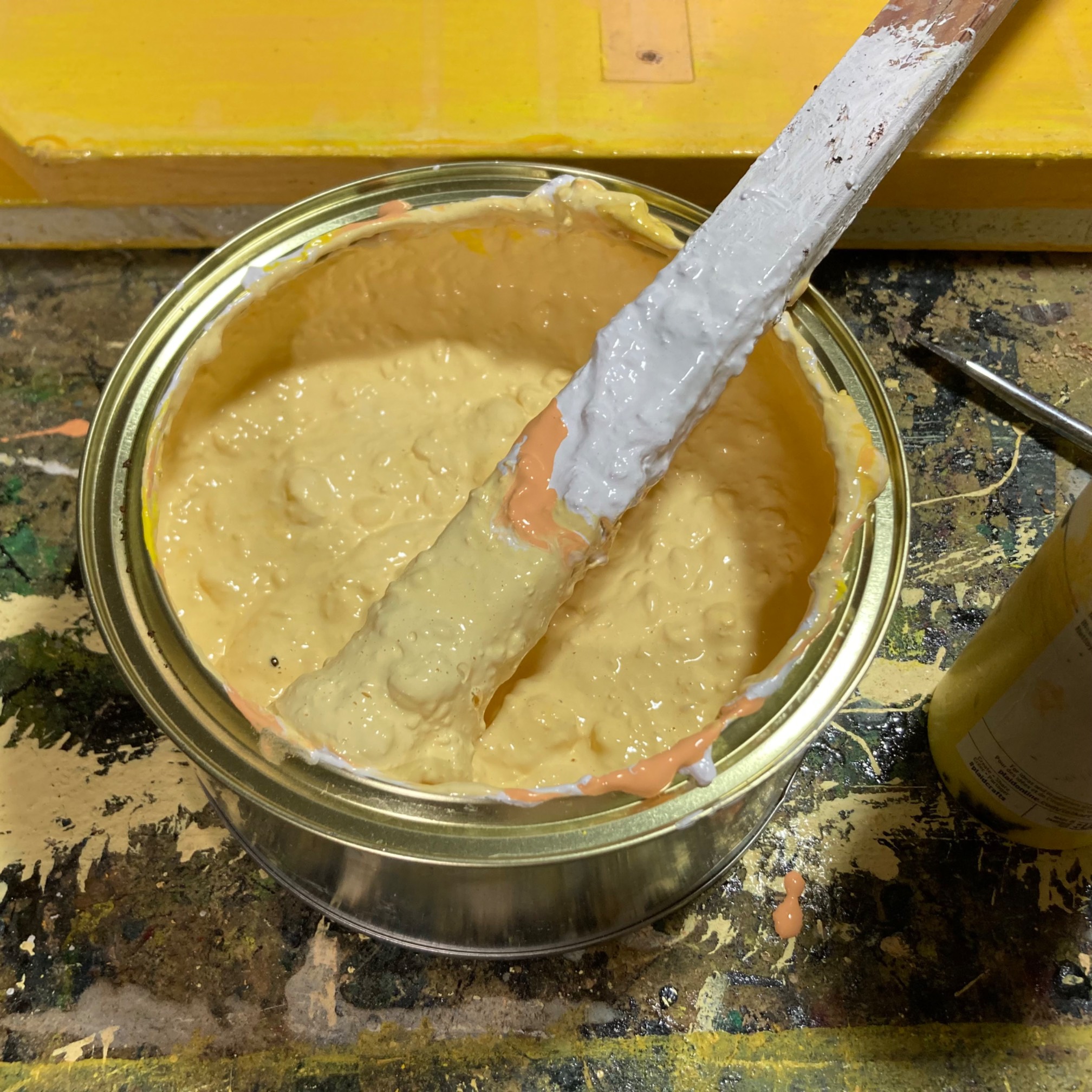Light yellow paint in a can