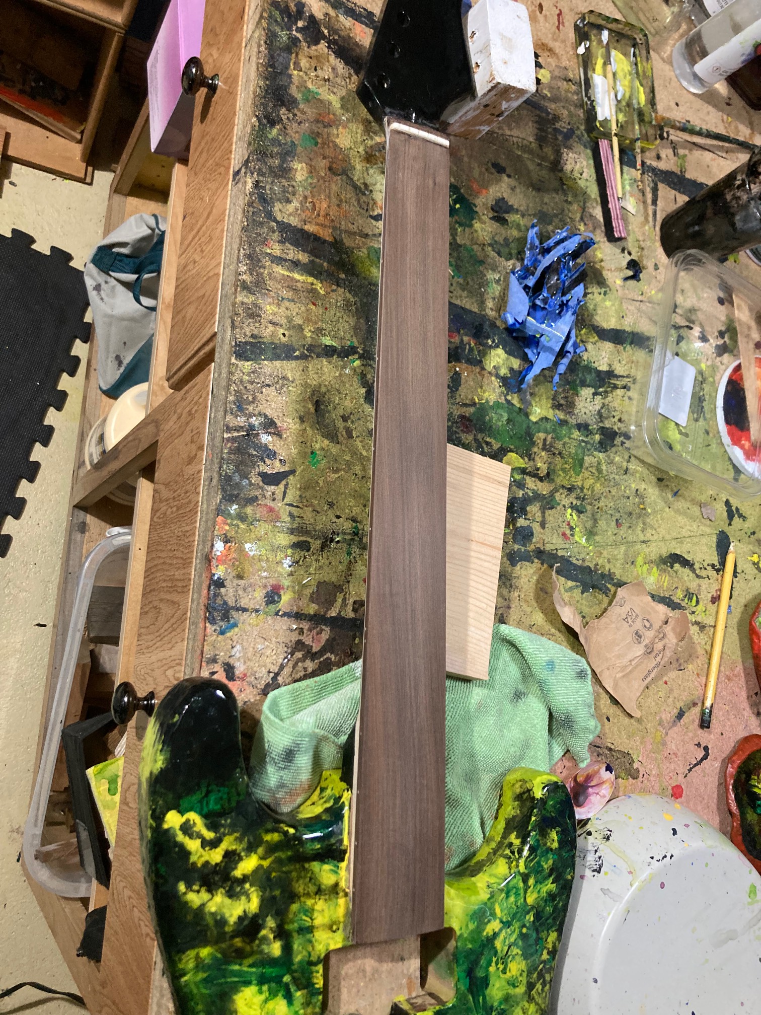 I was afraid to sand the fingerboard, but it was either risk scratching it up or have epoxy lumps on