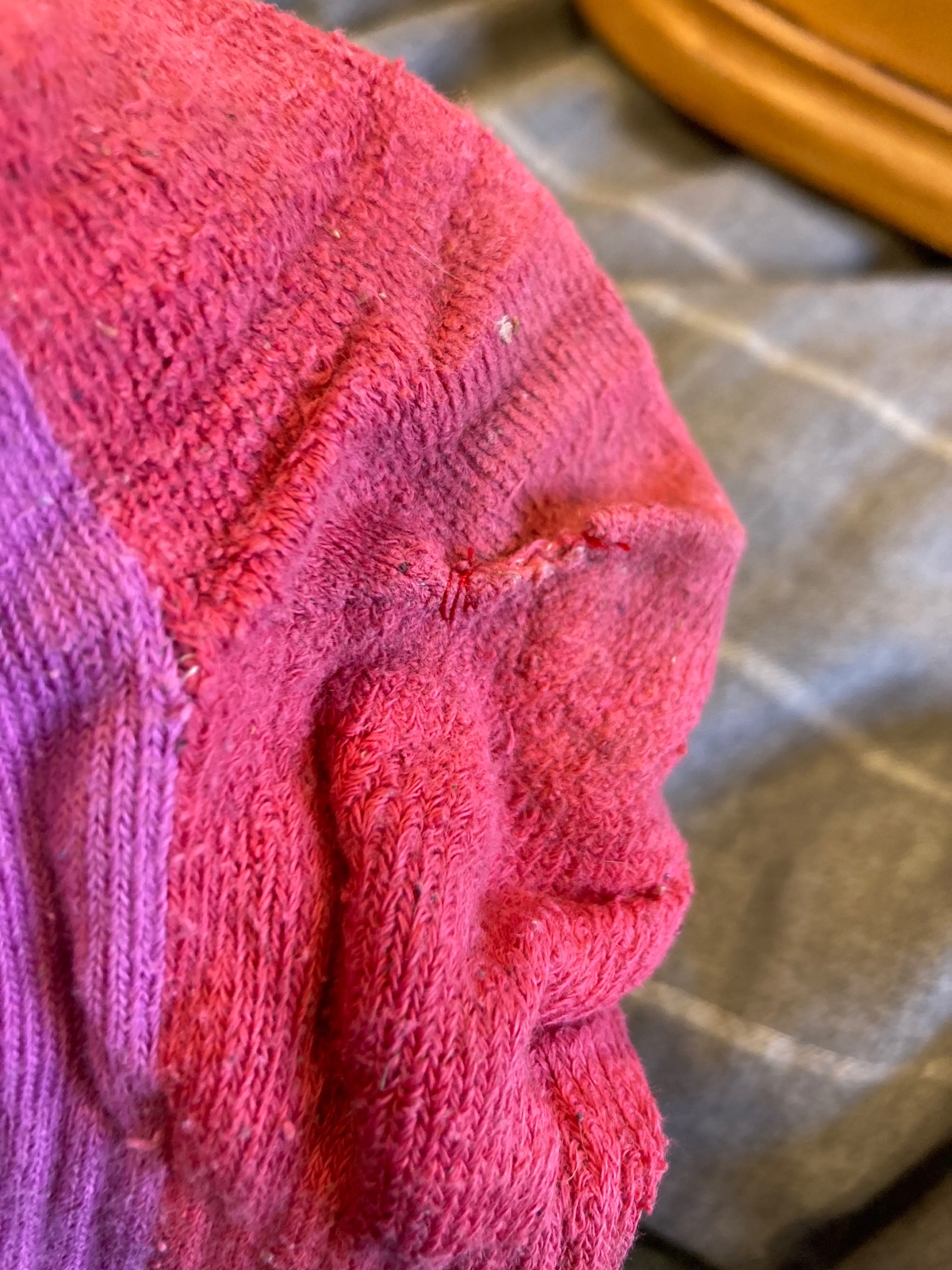 Sock with sewn-up hole