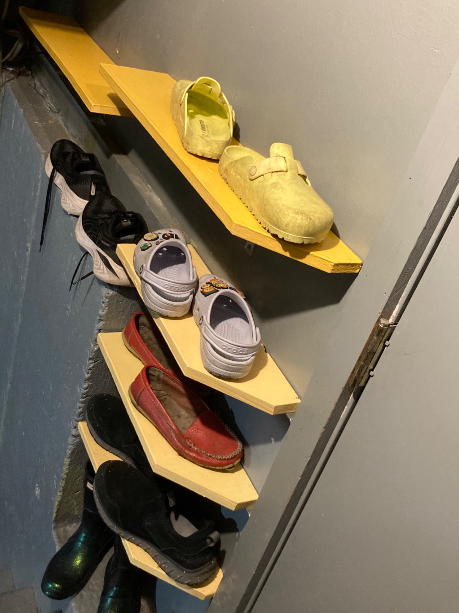 Shoe rack with shoes on them