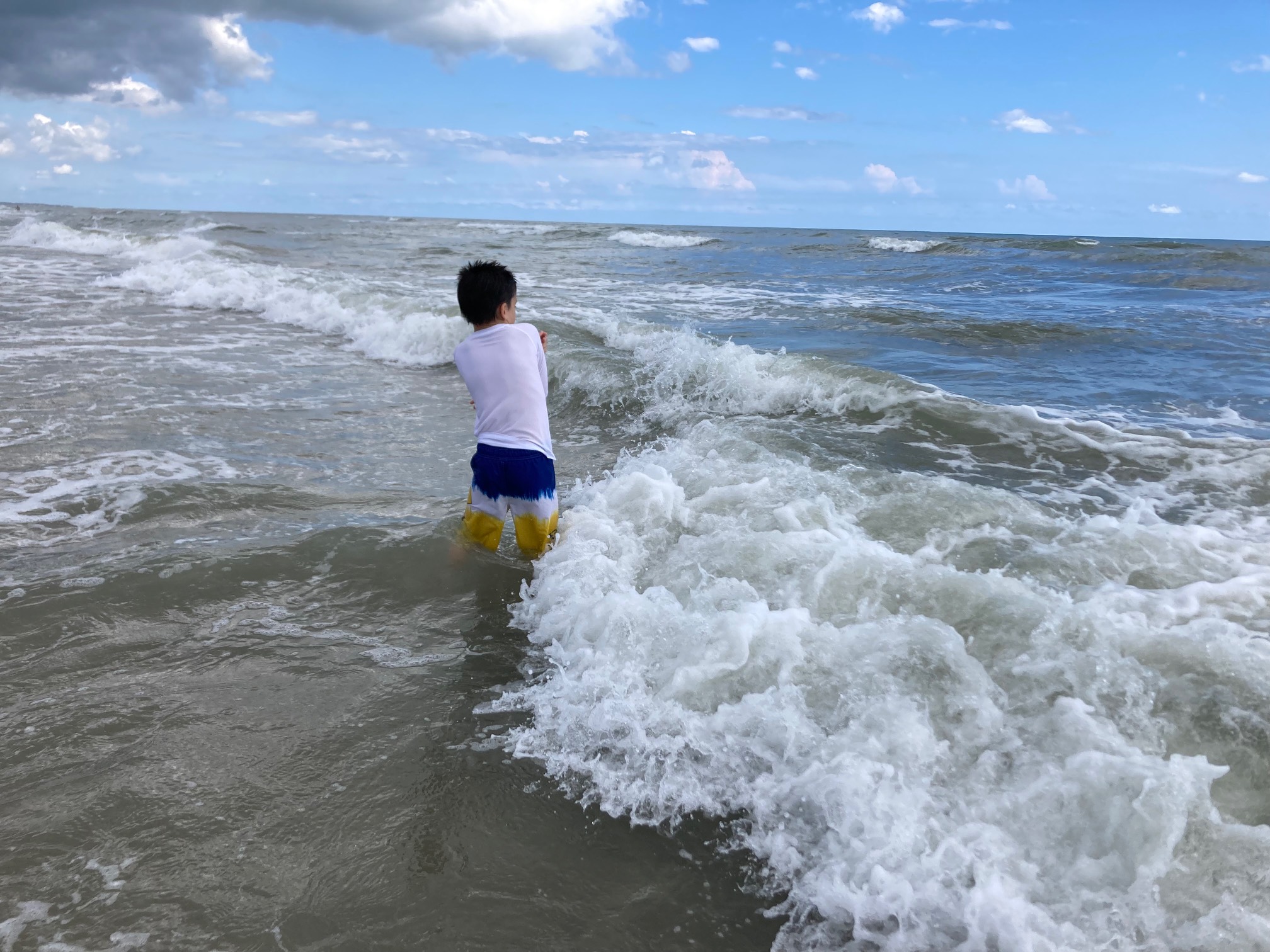 Waves approaching child