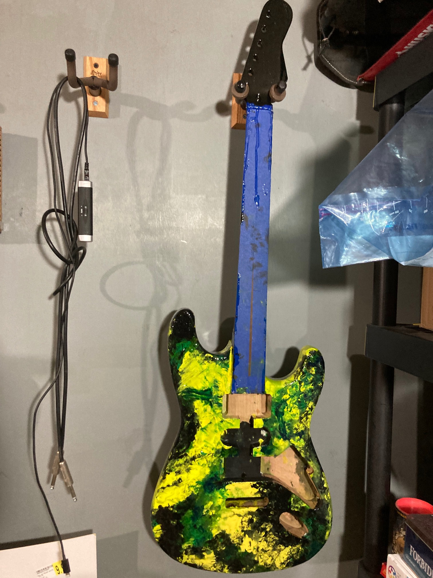 I coated the guitar in epoxy. It was chaos. I started then realized I didn’t know how to coat the wh