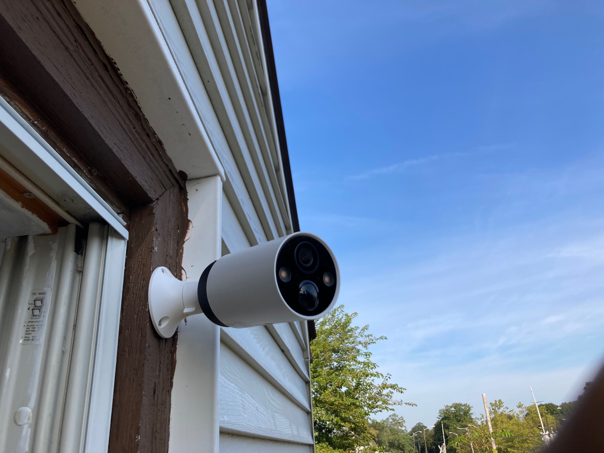 Camera mounted to window trim