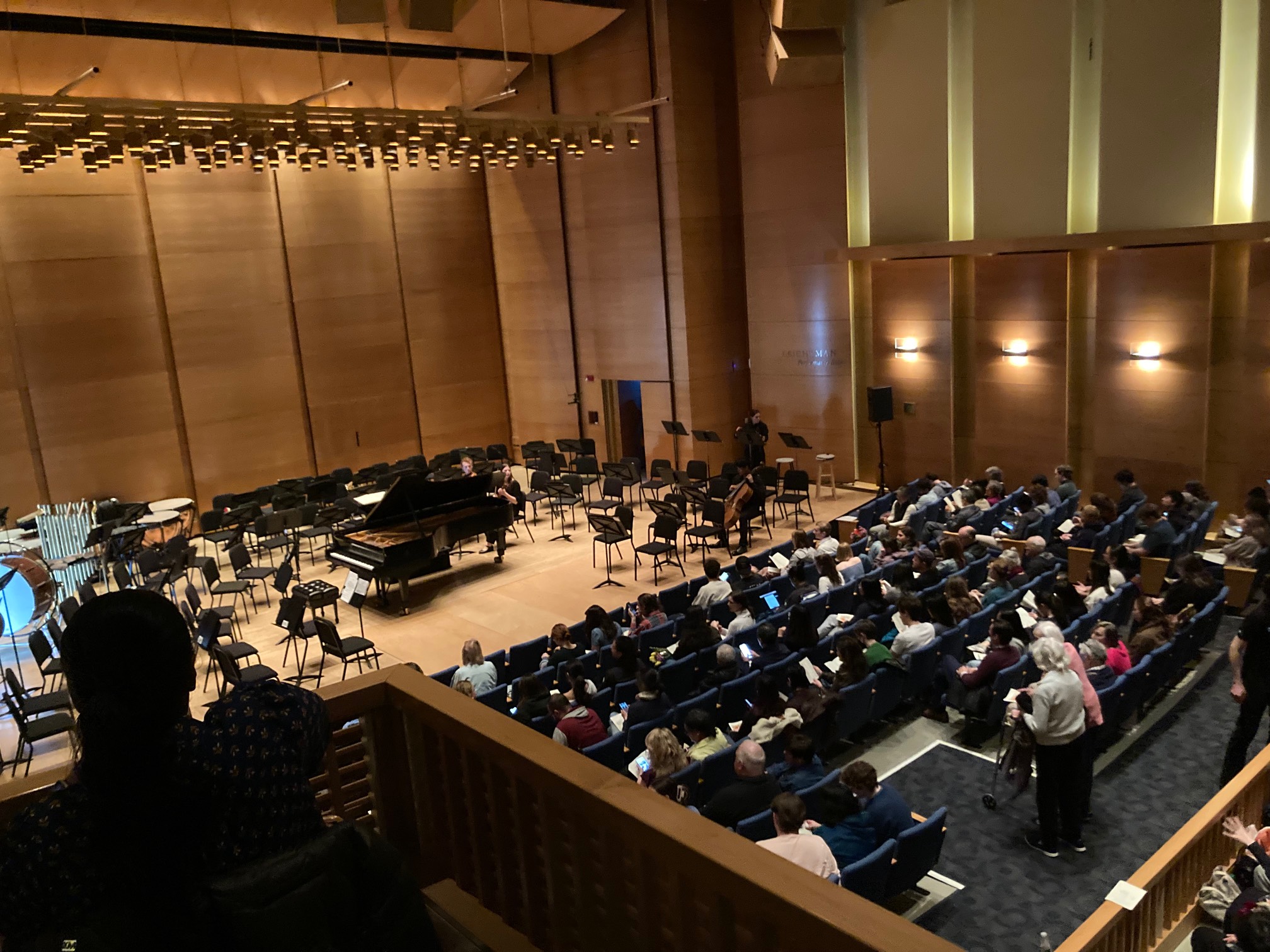 Full concert hall with orchestra on stage