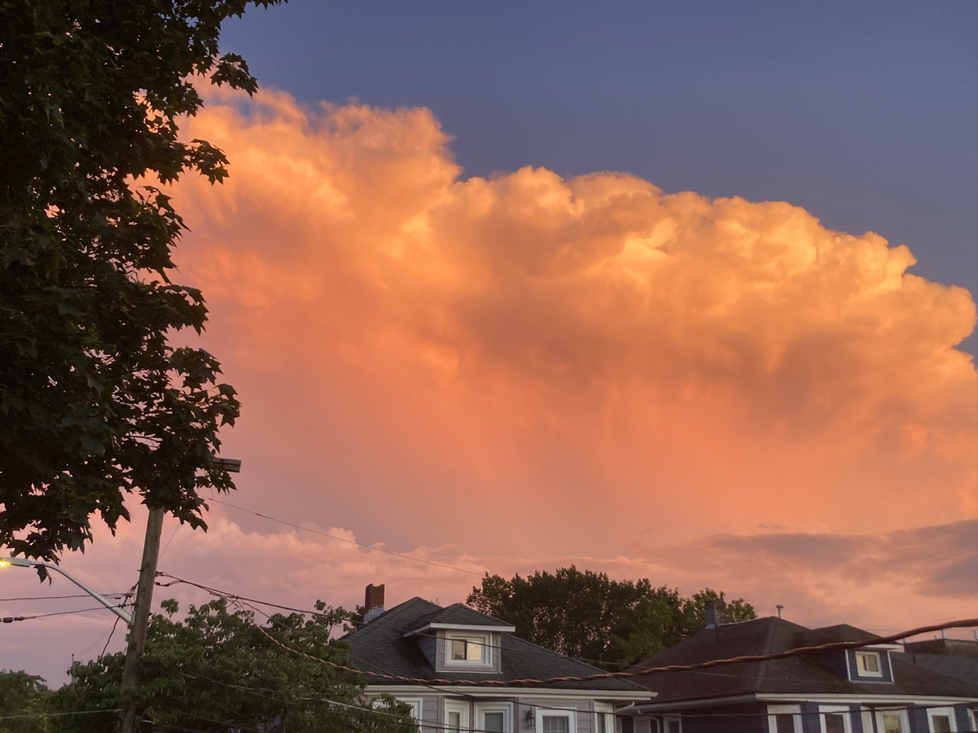 Pink cloud over houses