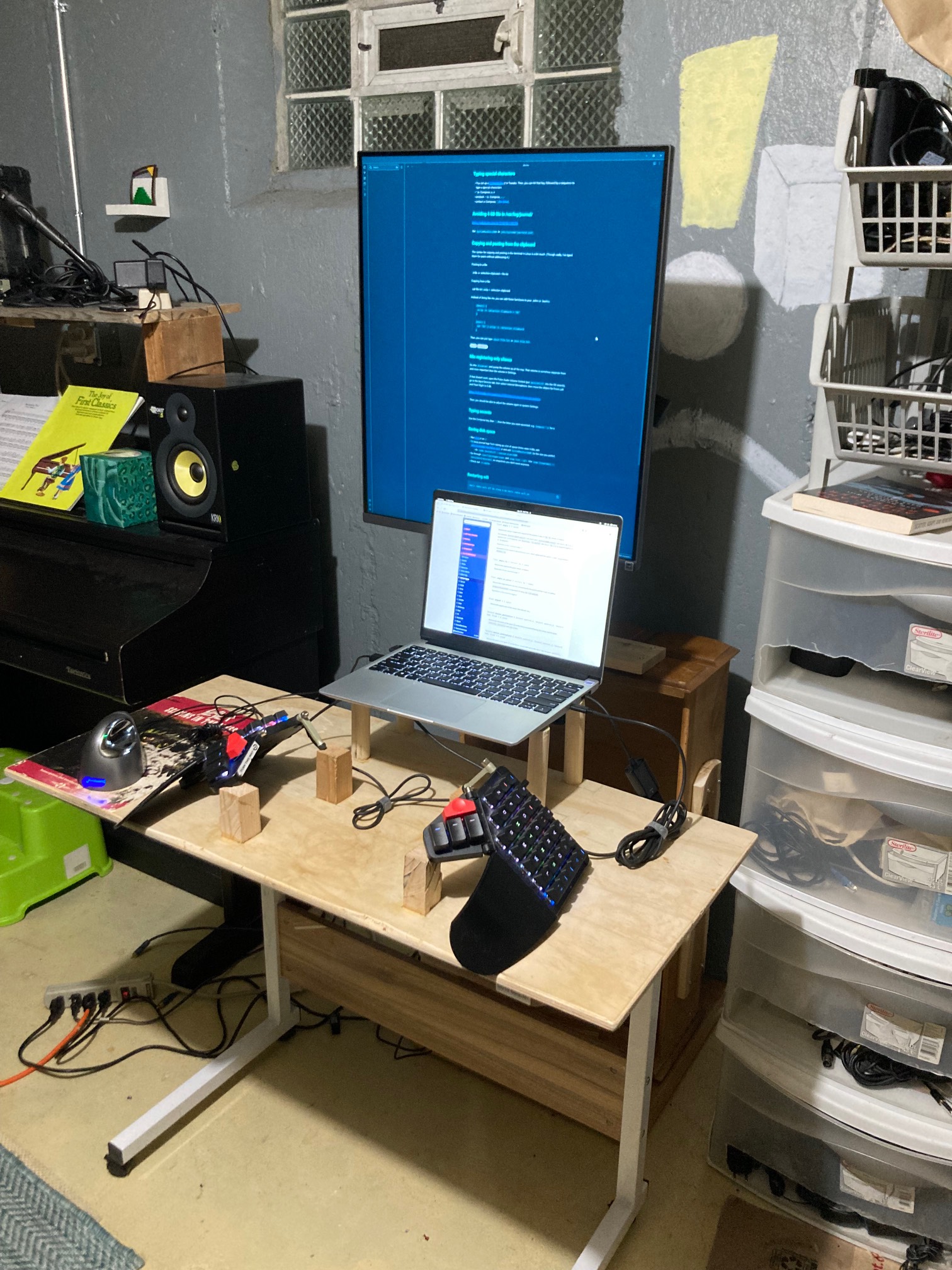 Monitor on stand with desk in front of it