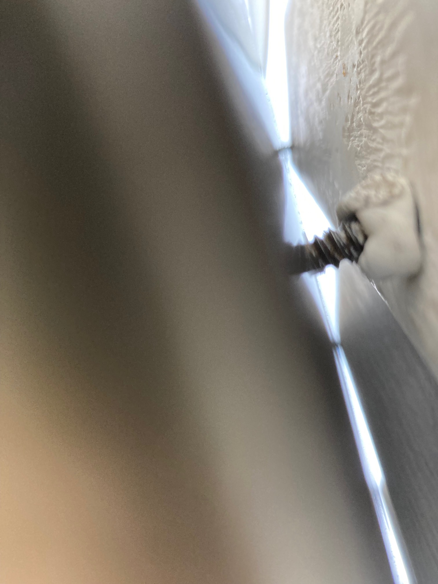 Screw connecting wall and mailbox with insulating goo