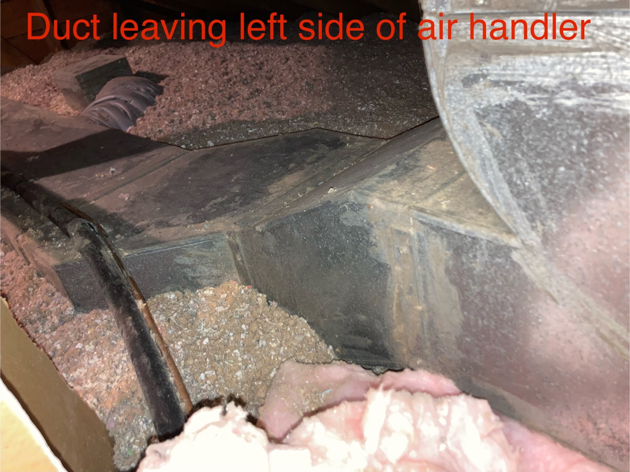 AC duct in attic with insulation