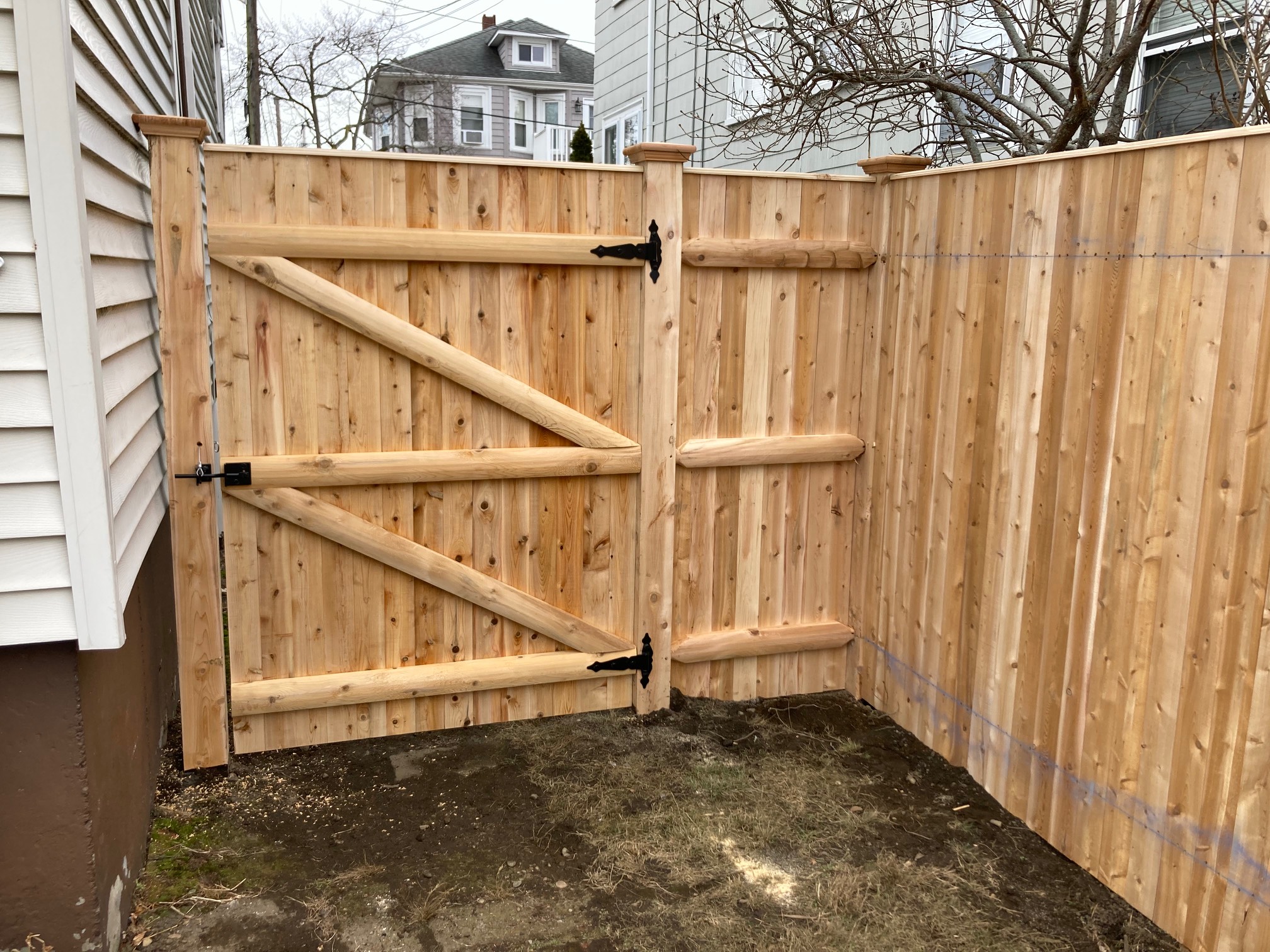 This gate kinda brings up the aesthetic level on our muddy yard and dated siding.