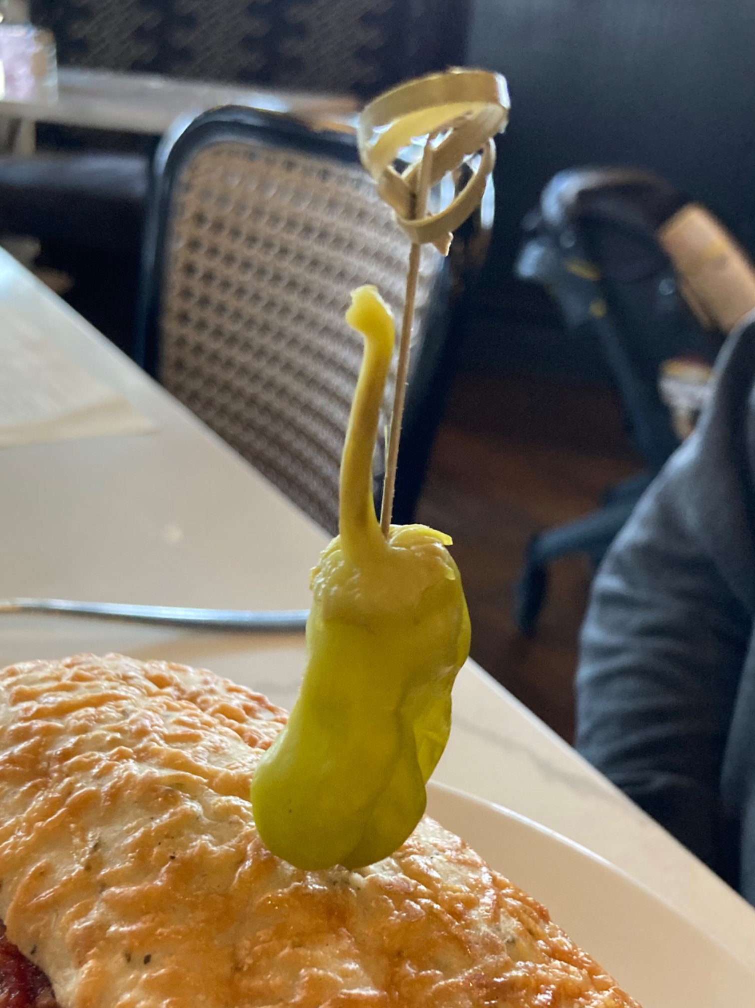 Sport pepper skewered on a sandwich