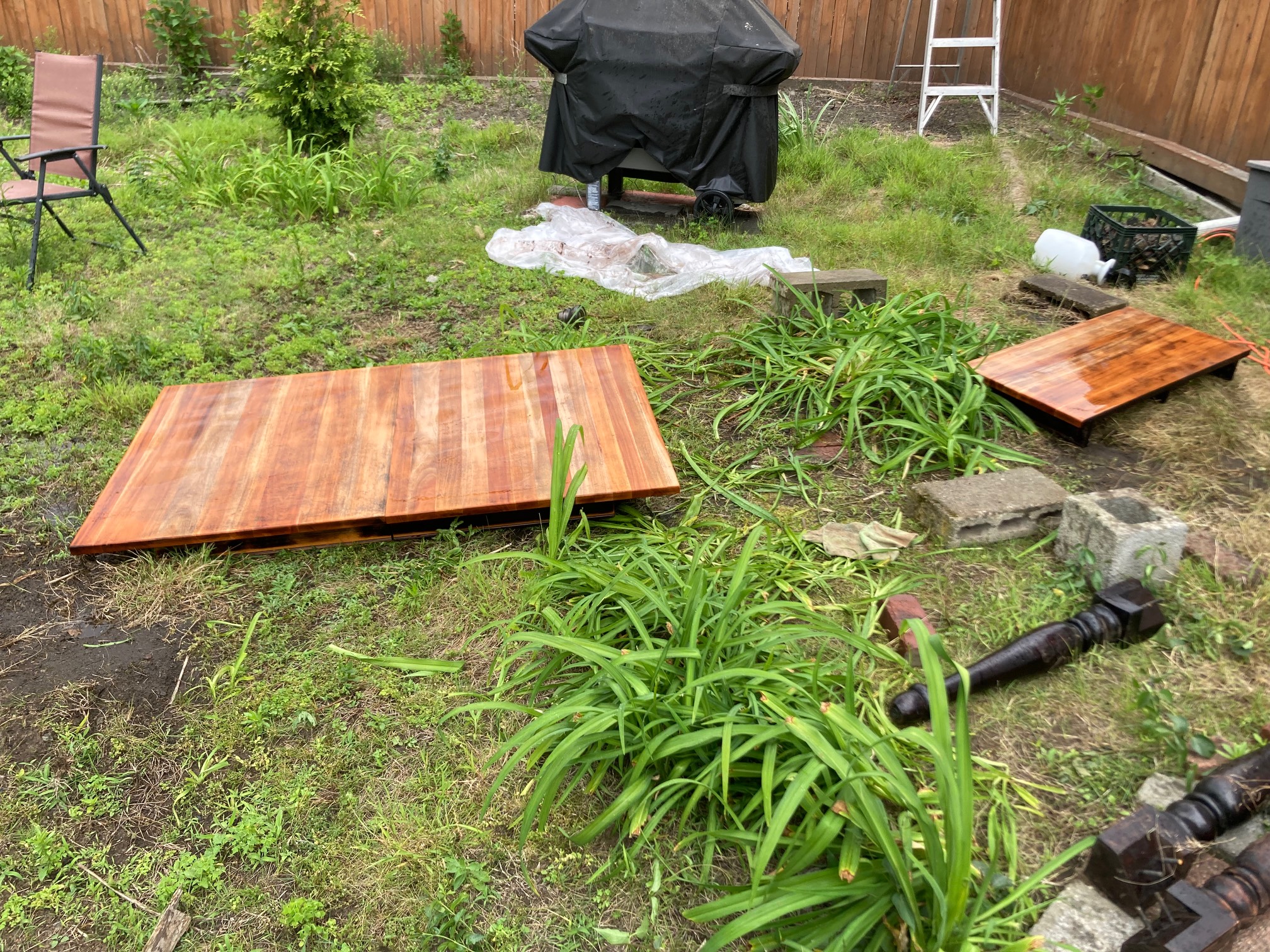 Multicolored wooden table top pieces in yard