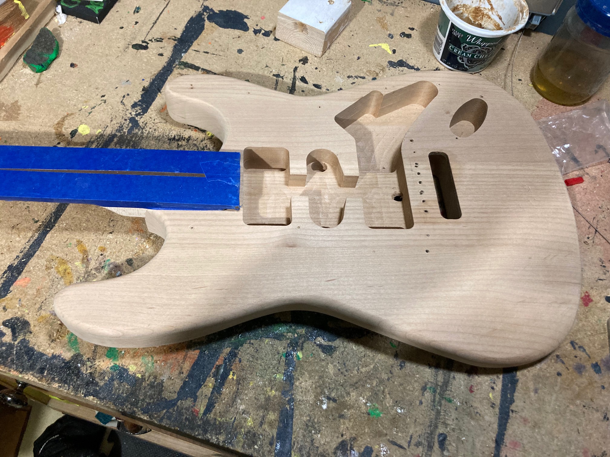 I decided the guitar is (barely) usable enough, so I’m going to actually paint it. I sanded it to my