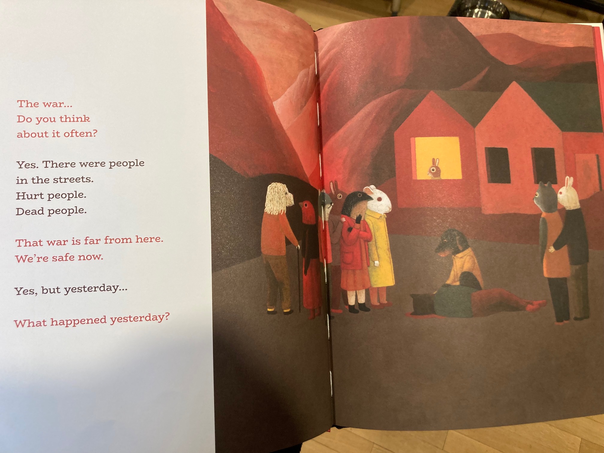 Children’s book page showing animals looking at another animal that’s been shot