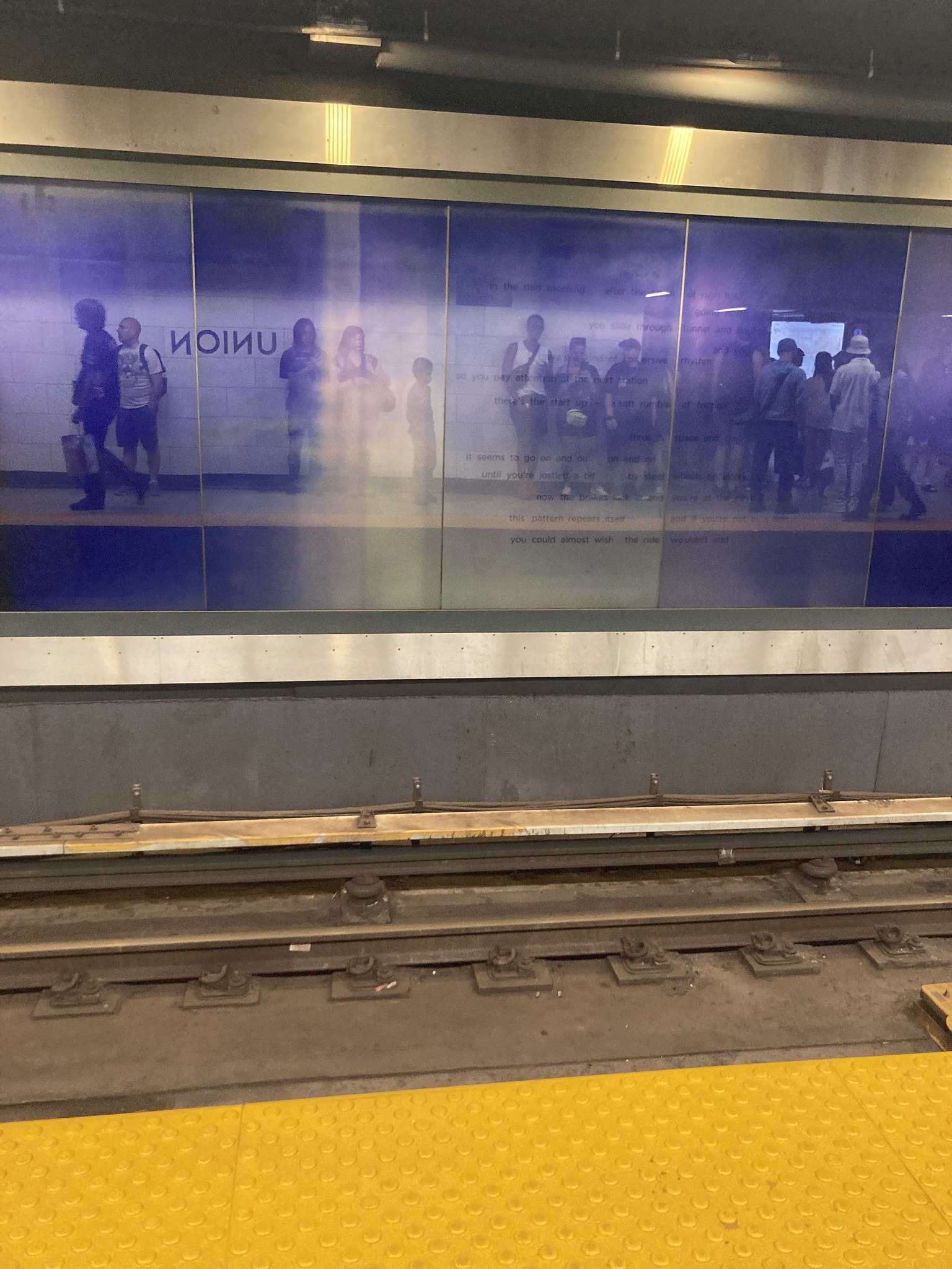 Train tracks, reflective purple windows
