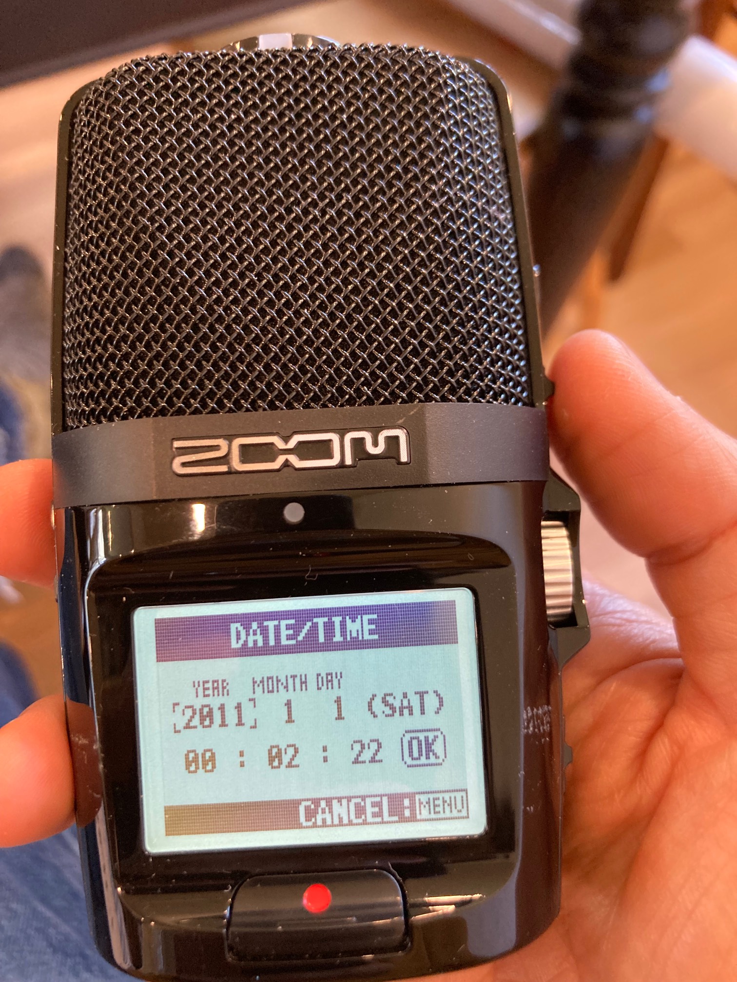 Handheld recorder LCD display showing a date of 2011