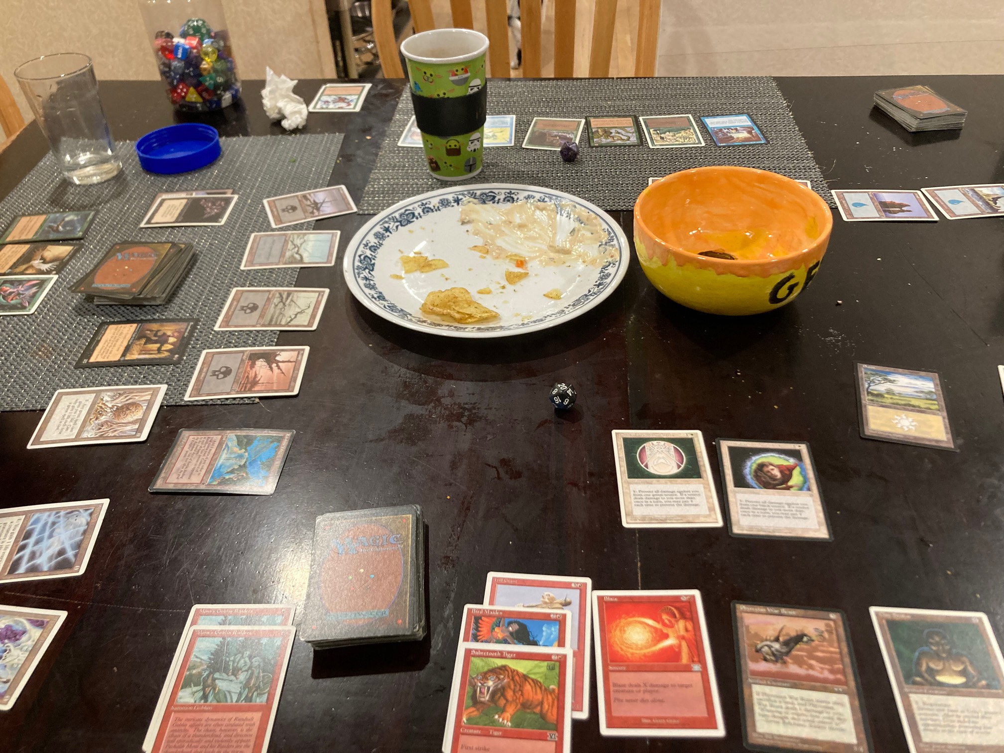 Cards and plate and bowl on table
