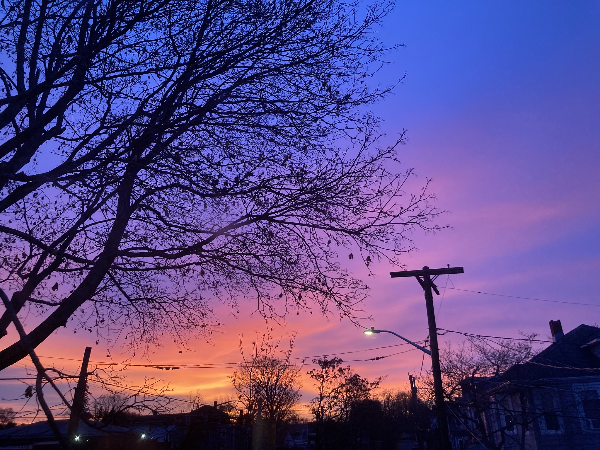 Sunrise over house rooftops