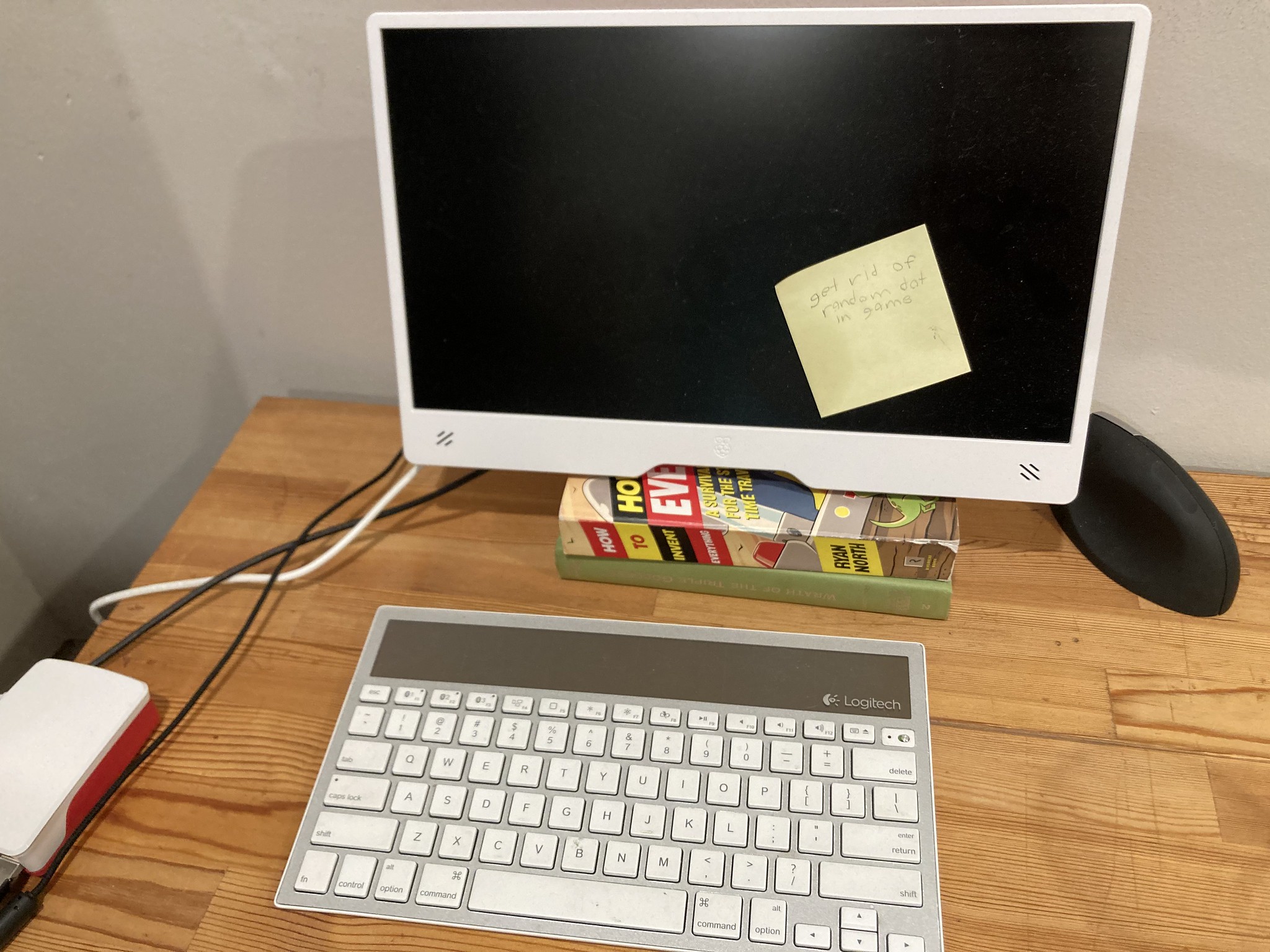 Computer with sticky that says 