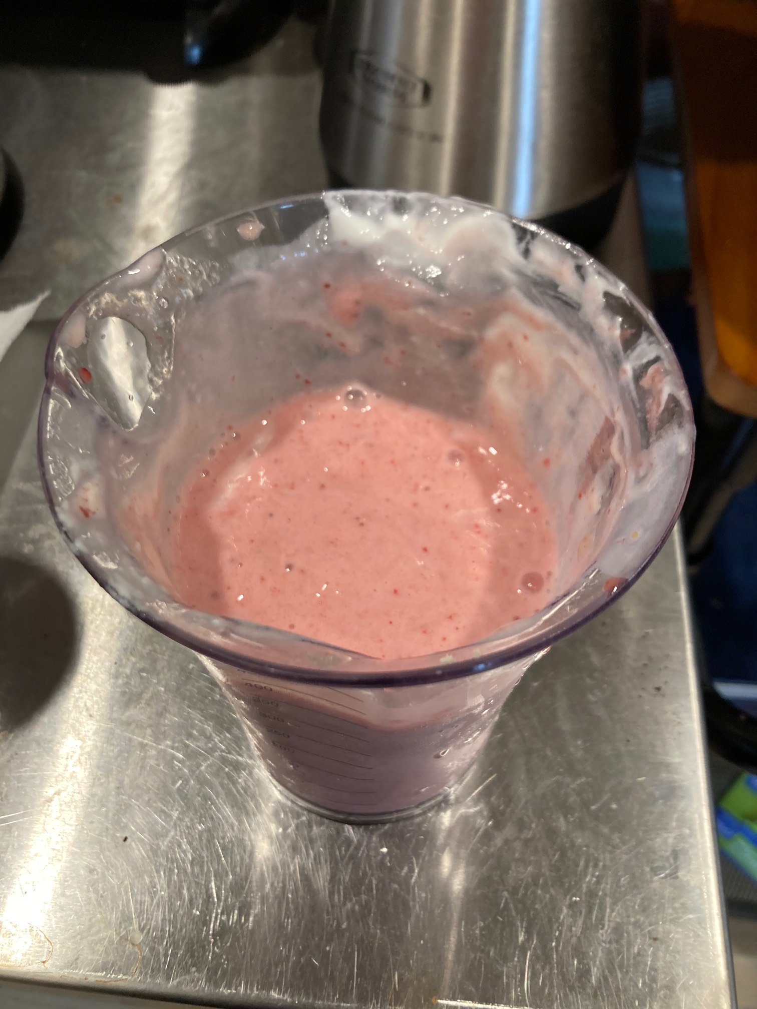 Pink smoothie in mixing cup
