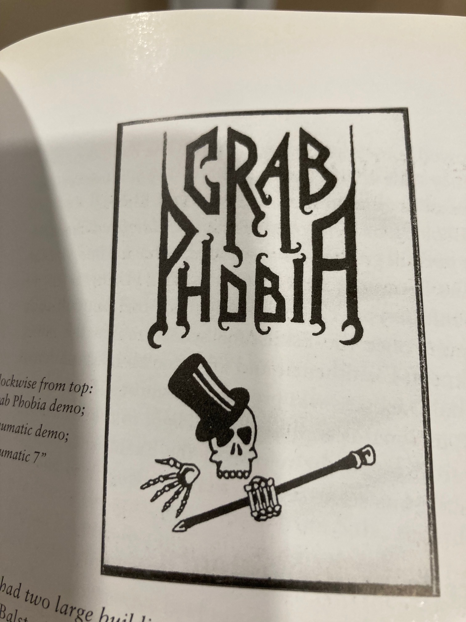 Crab Phobia logo: Skull with cane and top hat