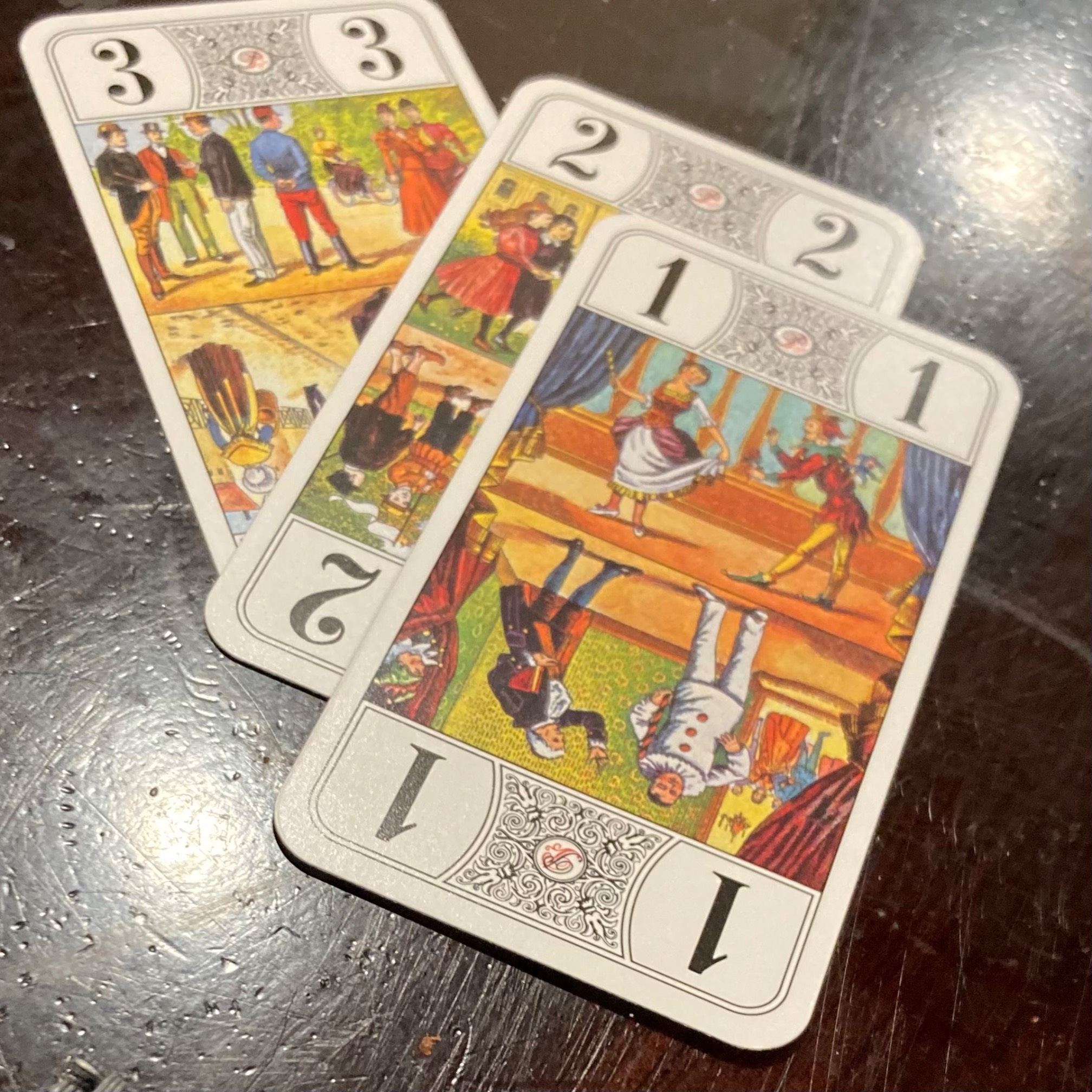 The whist cards 3, 2, and 1.