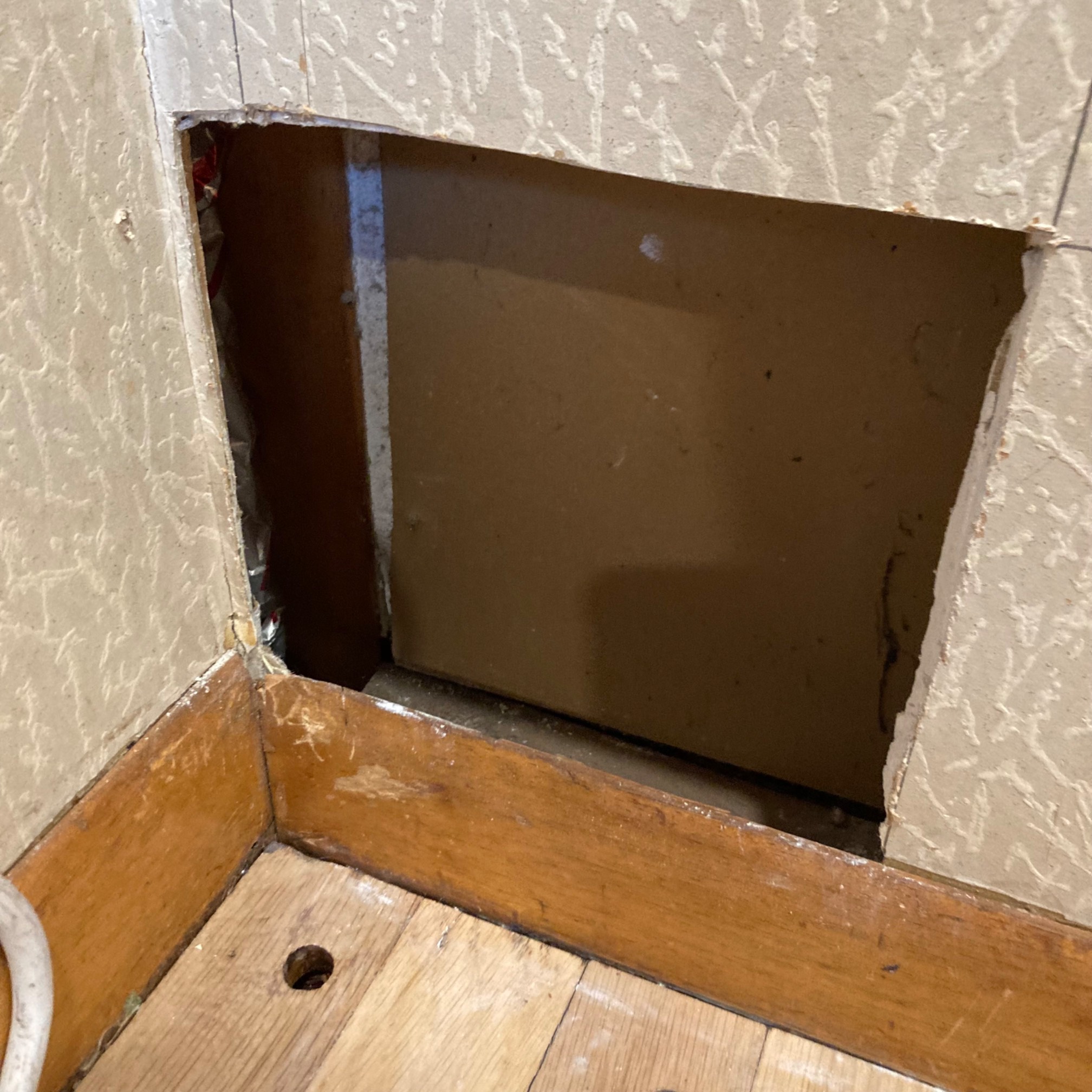 Square cut around drywall break