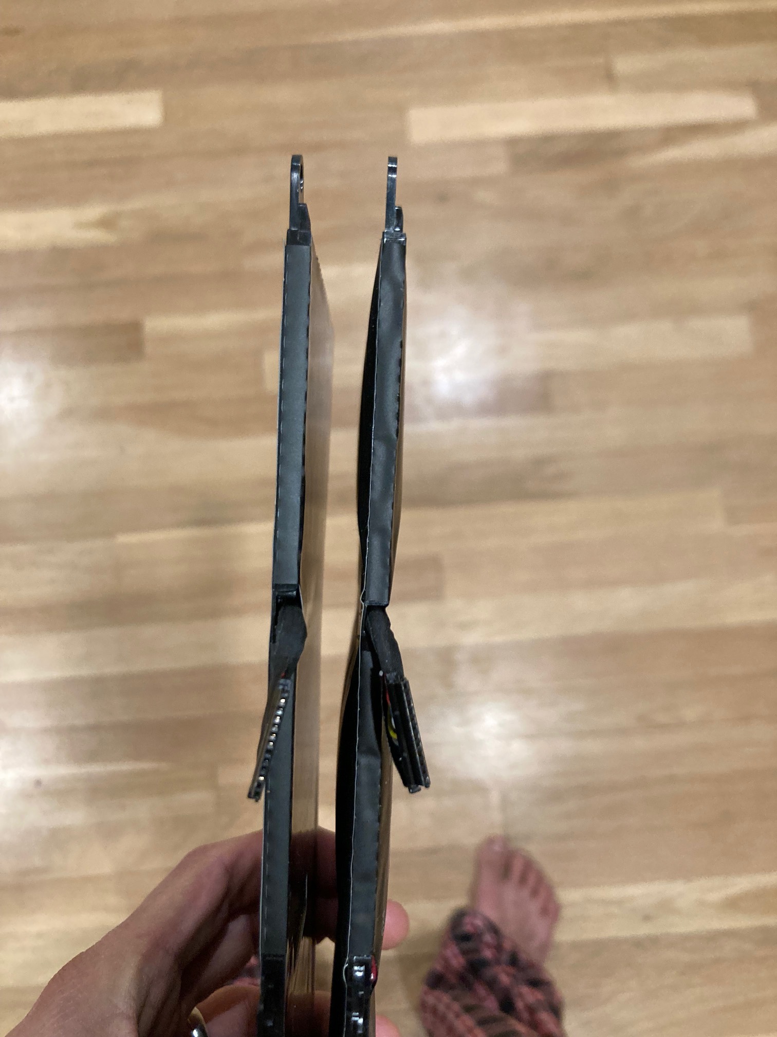 Two laptop batteries, one swollen