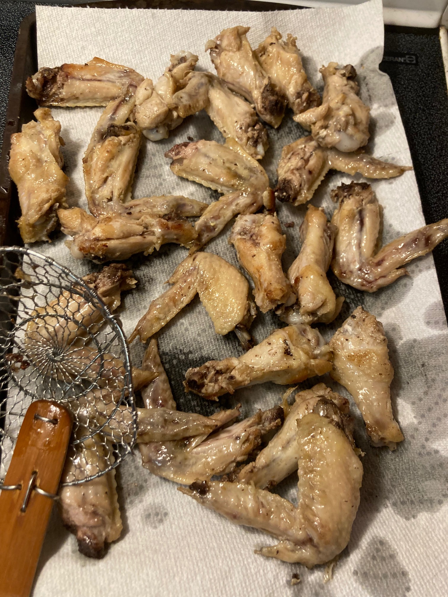I’ve had five pounds of frozen wings for well over a year, so I decided to cook them today. I’m doin