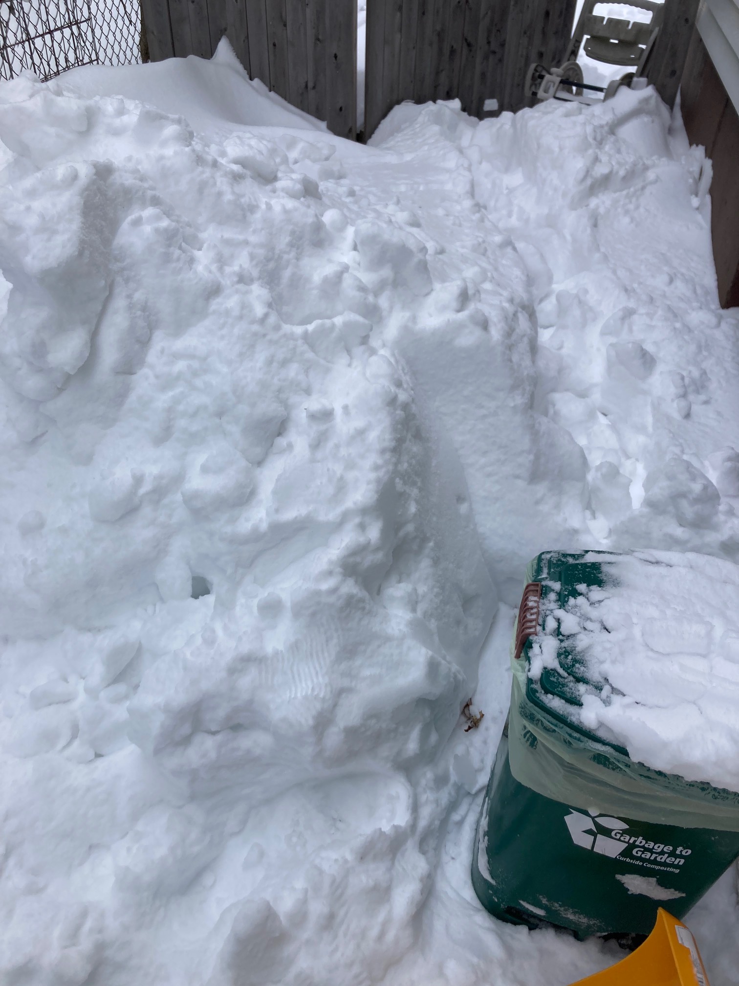 Snow pile next to bin