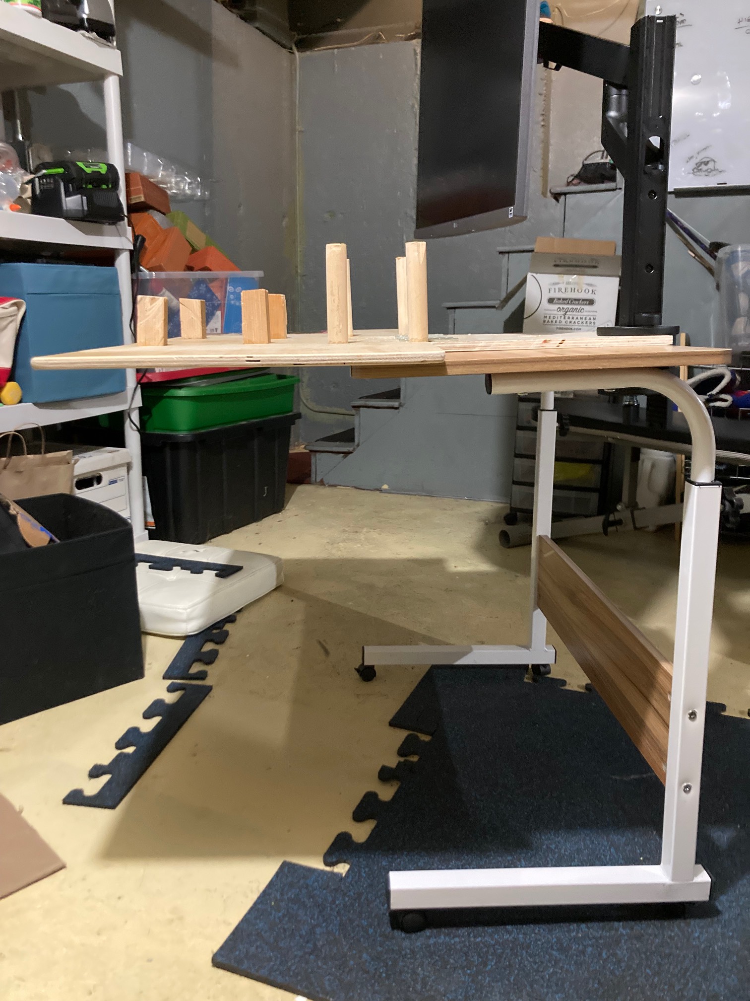 Desk with board and monitor on it