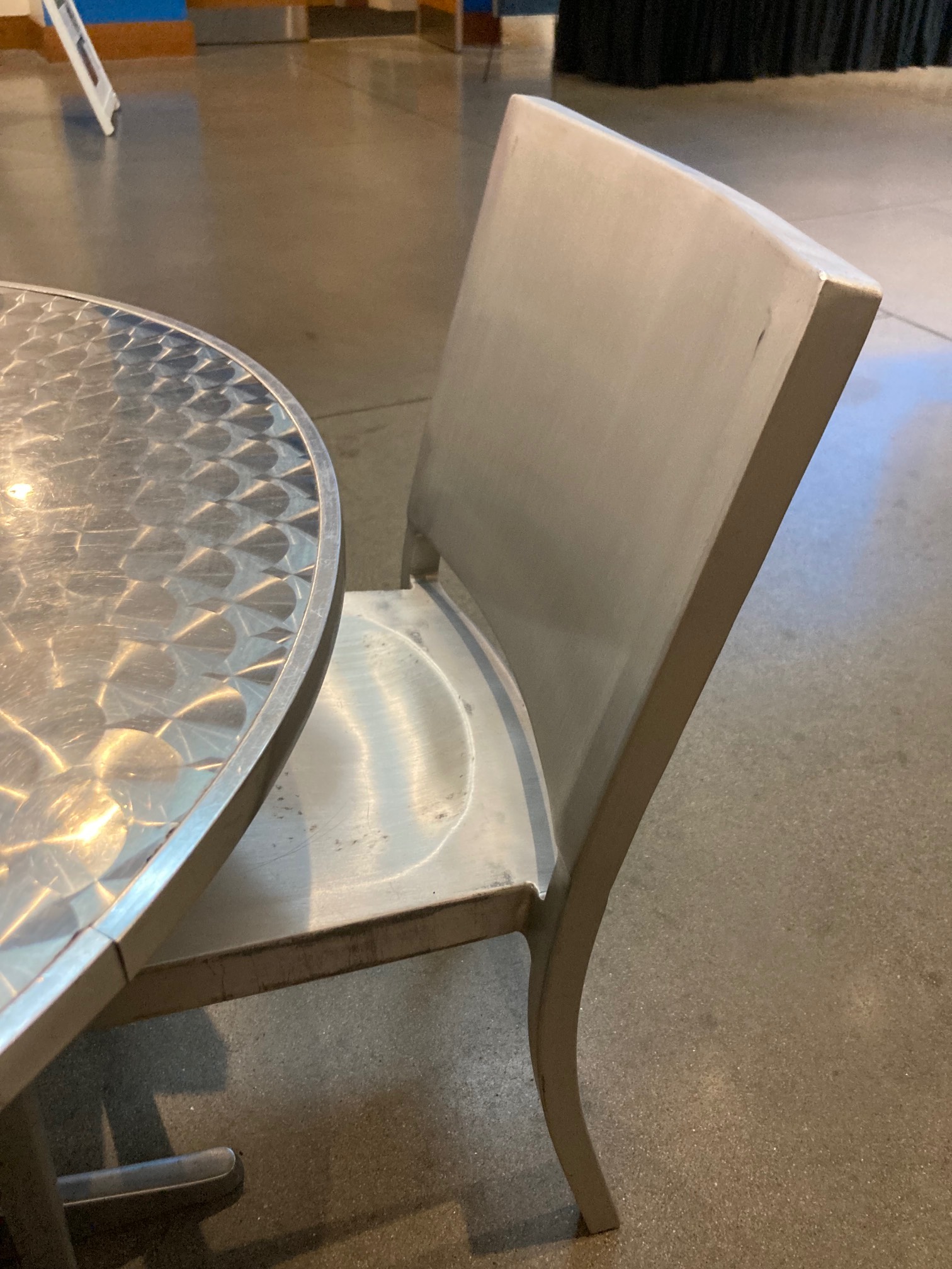 Aluminum chair by aluminum table