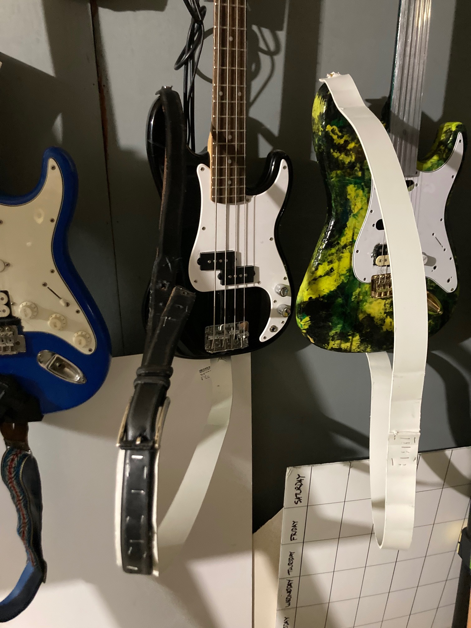 Plastic guitar straps on bass and guitar