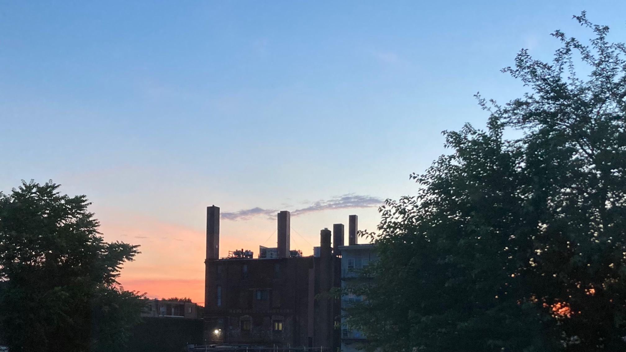 Smokestacks (not really; the clouds just happened line up with this building’s fake chimneys)