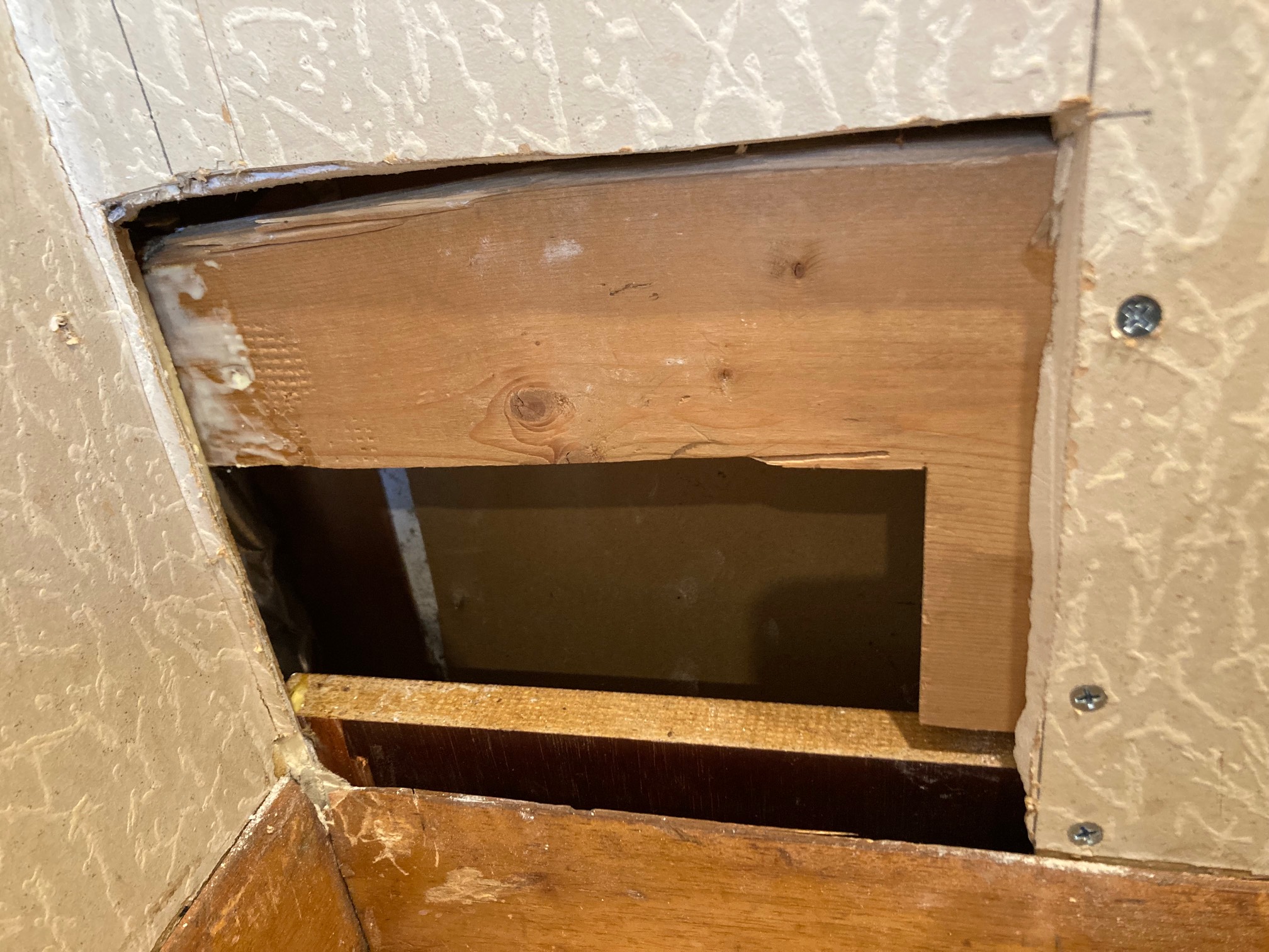 Drywall hole with two boards inside
